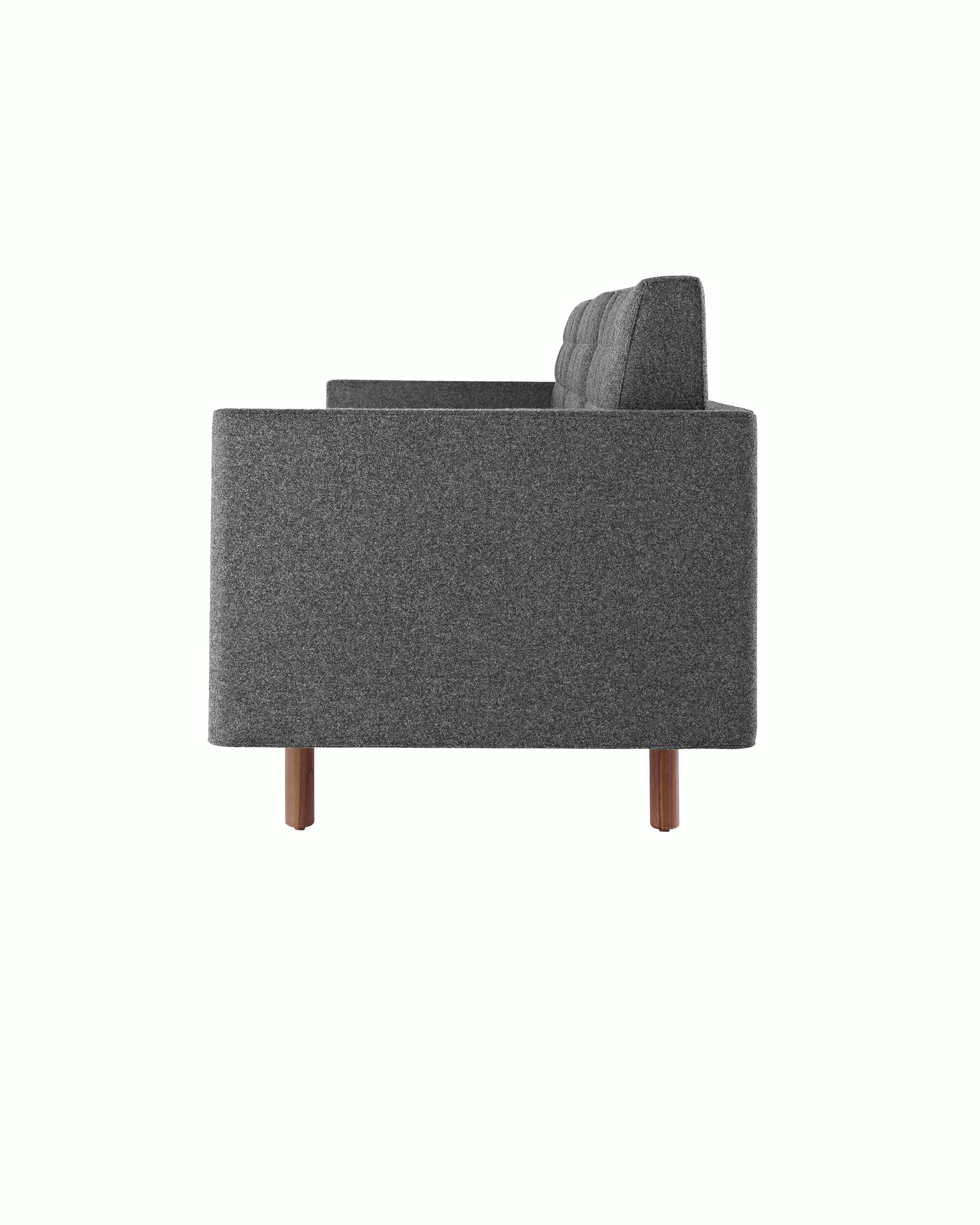 Side view of a Tuxedo Classic club chair upholstered in dark gray fabric.