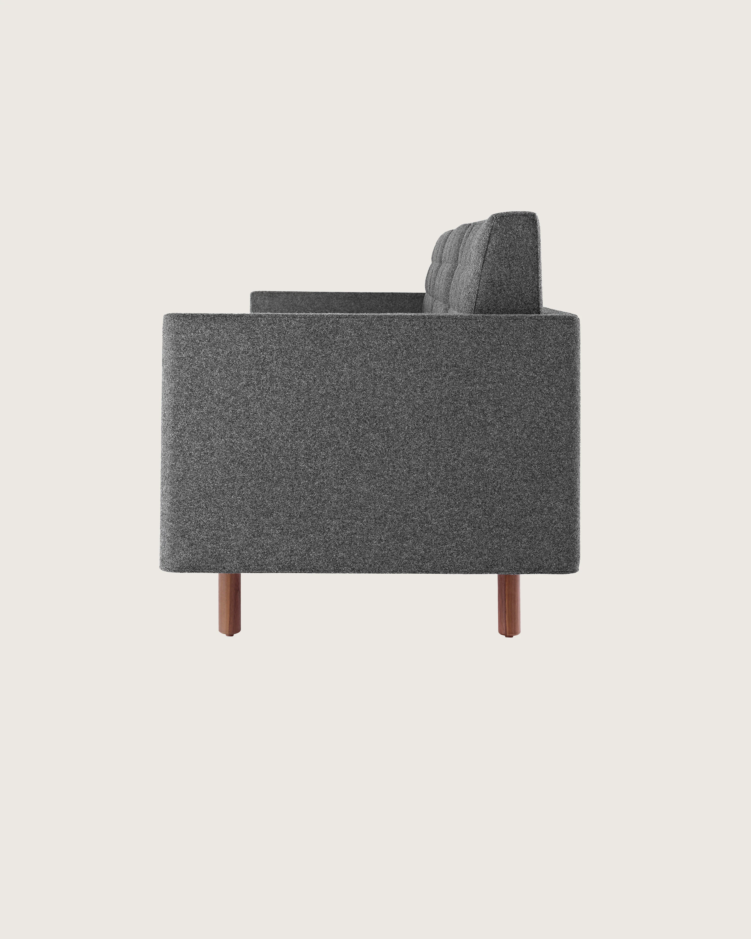 Side view of a Tuxedo Classic club chair upholstered in dark gray fabric.