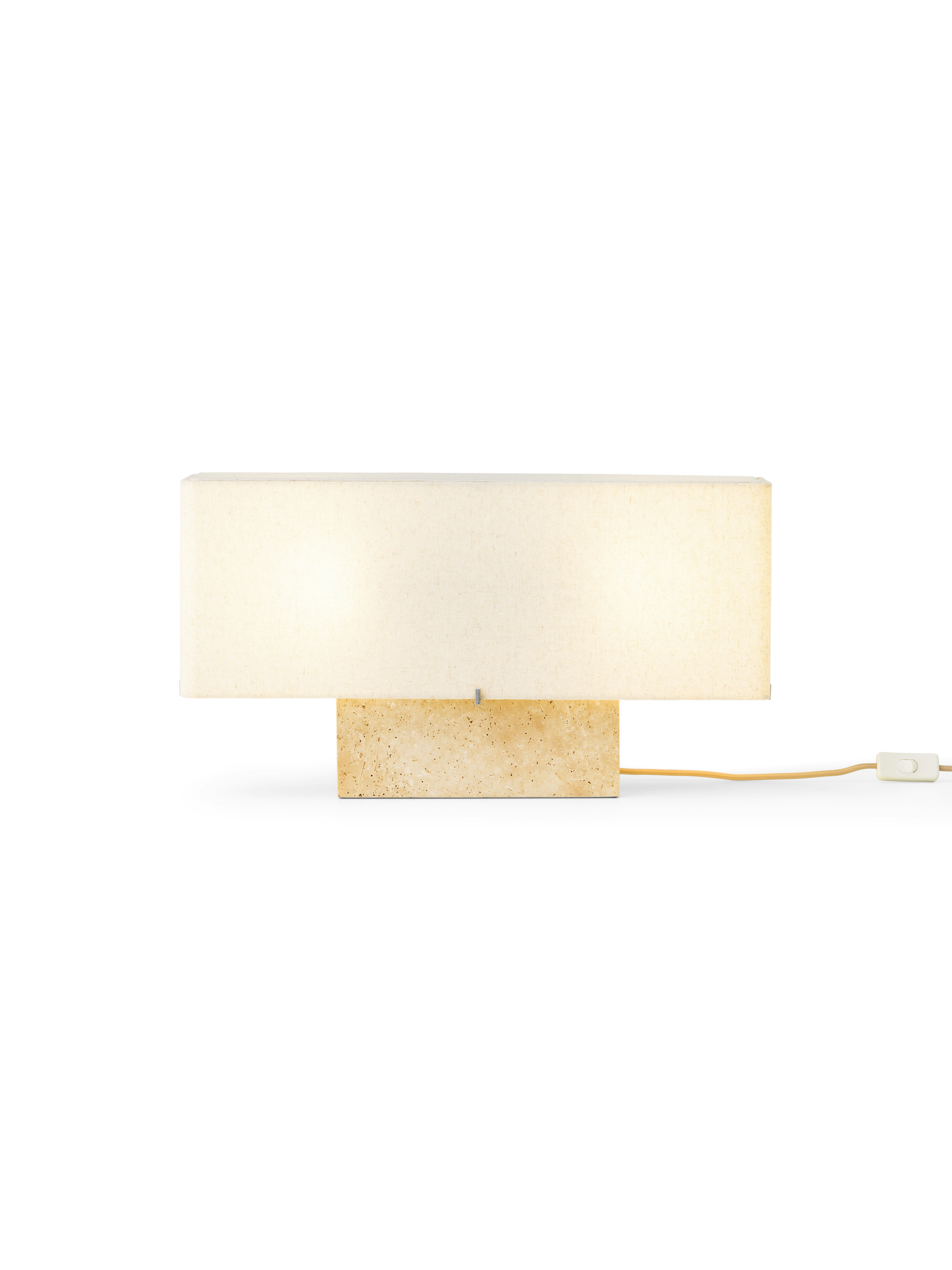A Nonna Travertine Table Lamp  viewed from the front.