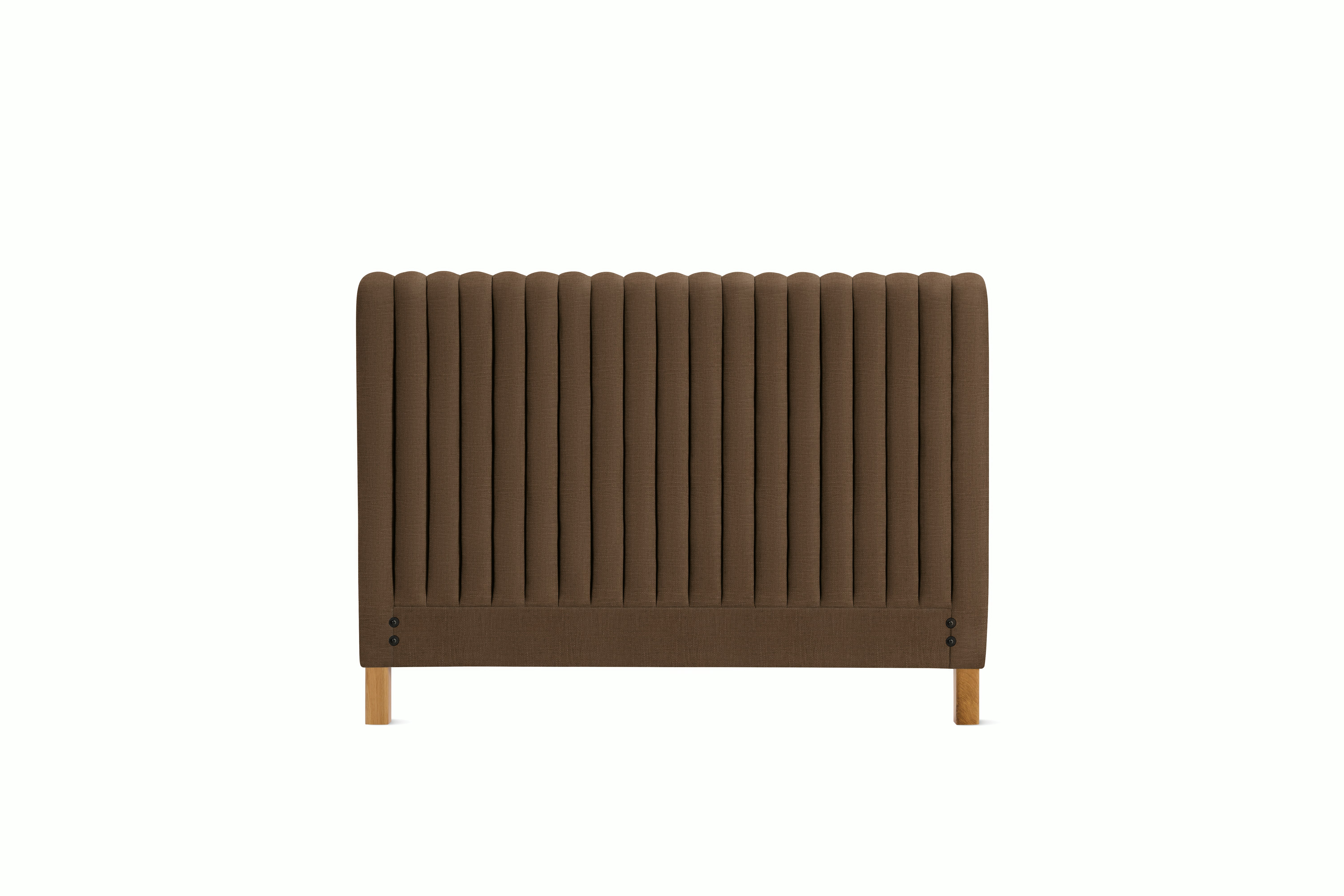 A Charlotte Headboard in Walnut viewed from an angle.