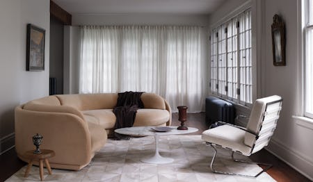 Poet Sectional in Malibu Dune with Saarinen Coffee Table and Tugendhat Armchair