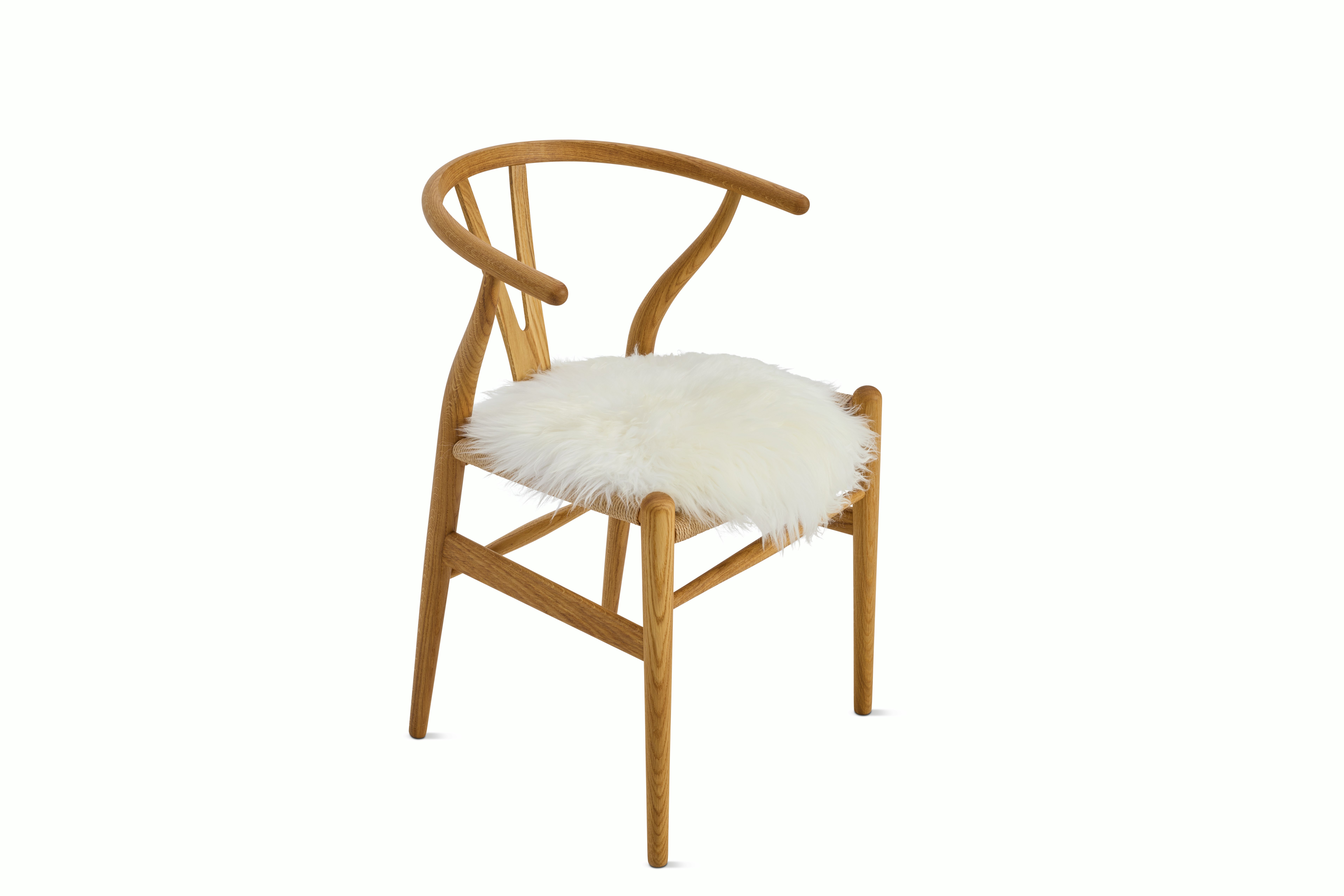 A detailed look at Sheepskin Seat Throw in Ivory Wishbone.