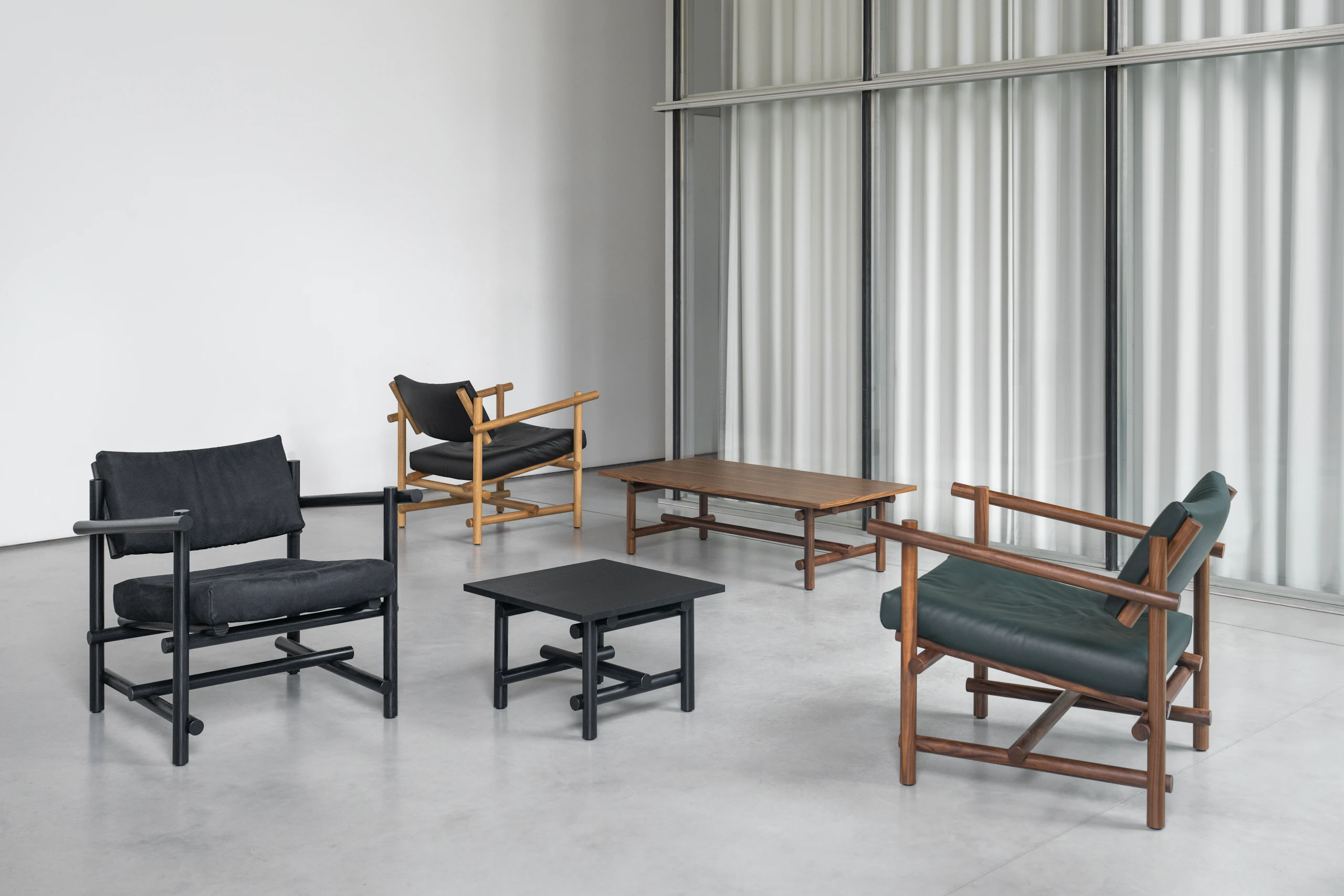 Muecke Lounge Chairs, Ottoman and Muecke Coffee and Side Tables.