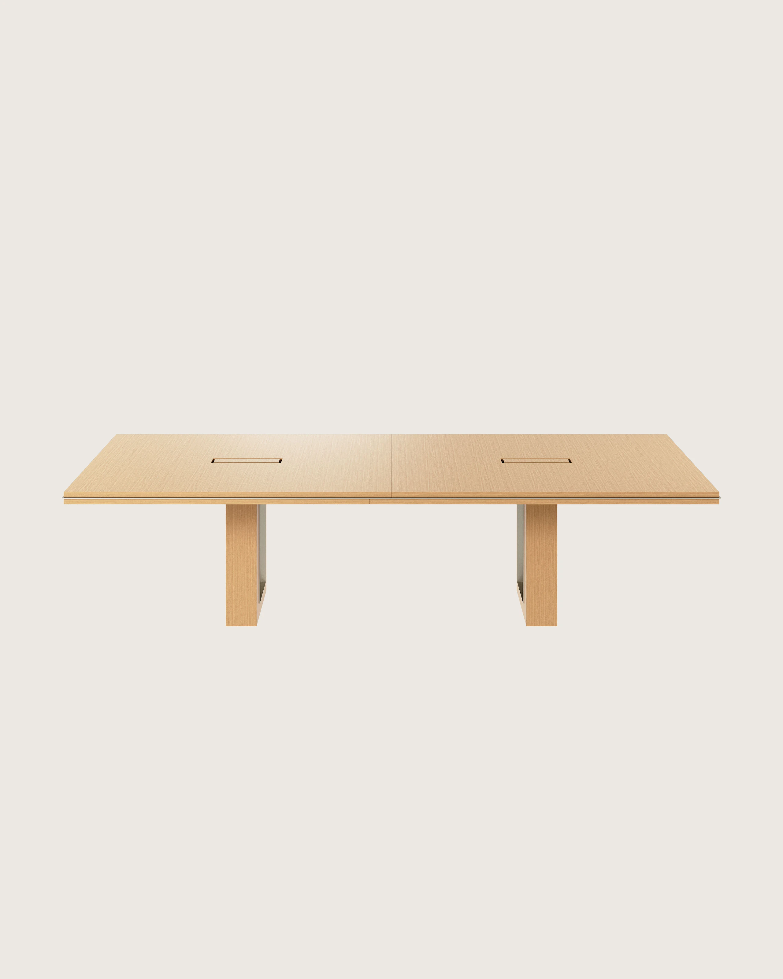 Rectangular Highline Fifty Conference Table in Natural Rift Cut Oak with a Satin Nickel edge and base trim viewed from the front.