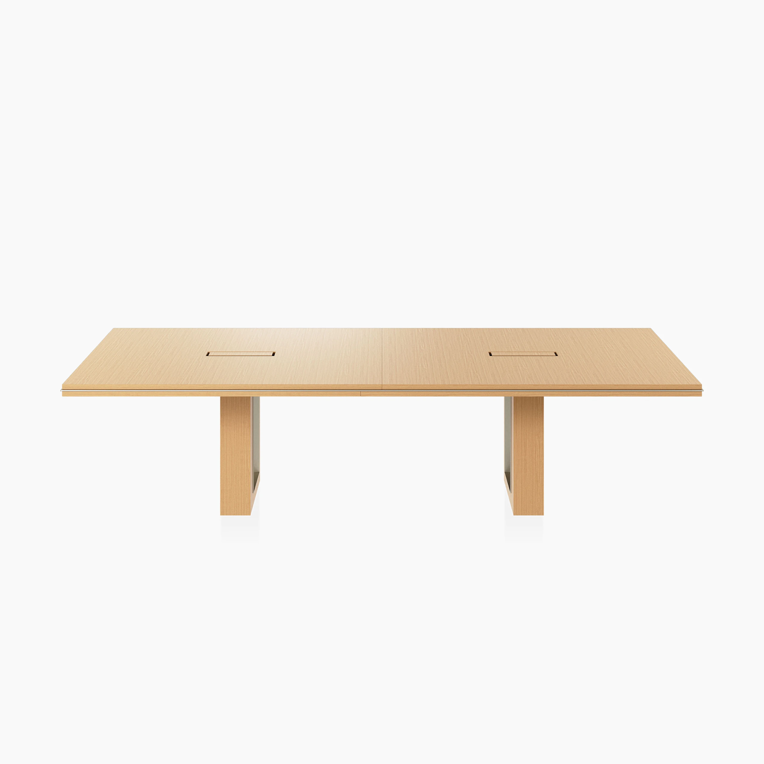 Rectangular Highline Fifty Conference Table in Natural Rift Cut Oak with a Satin Nickel edge and base trim viewed from the front.