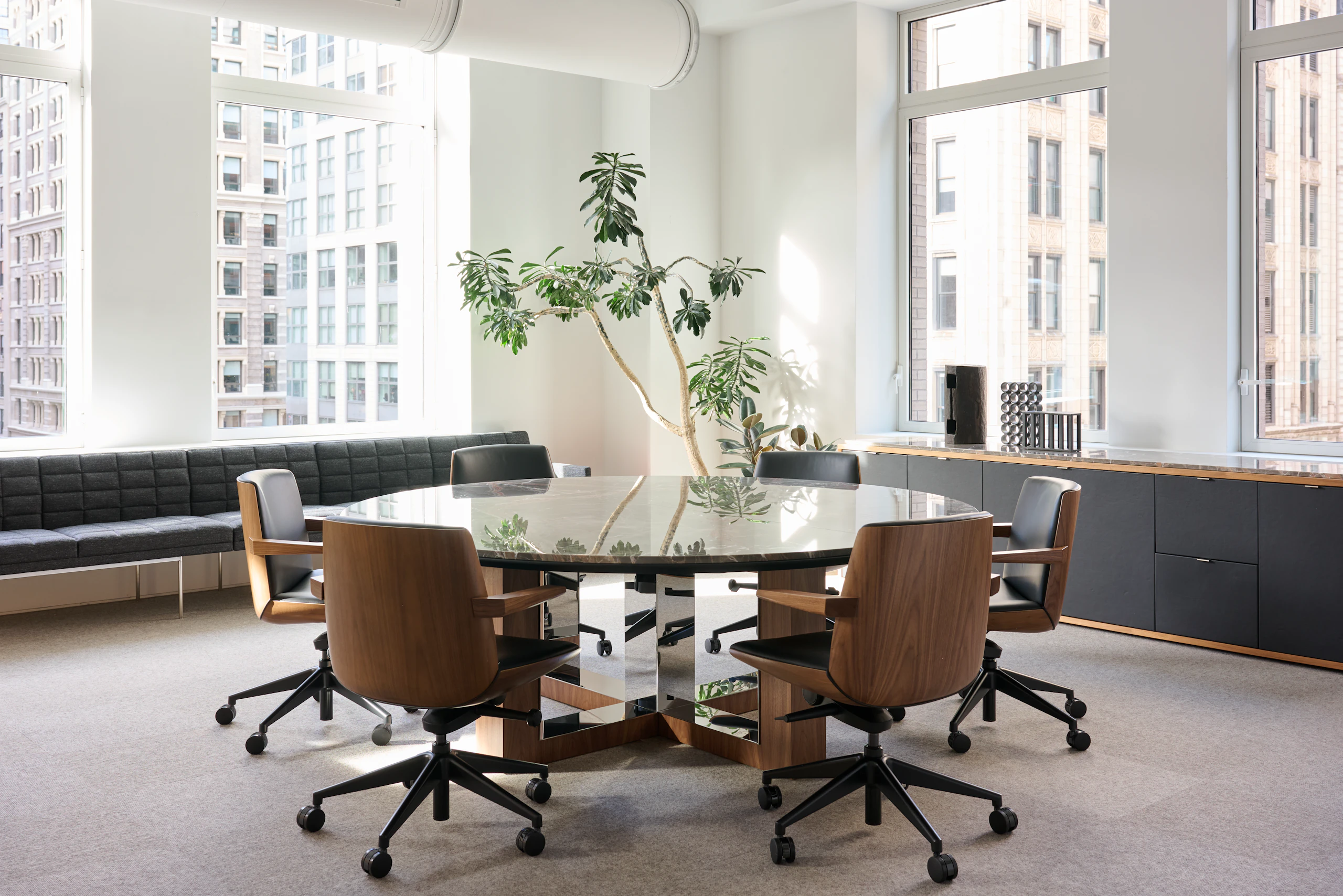 Highline Fifty Meeting Table with Clamshell Chairs in a meeting room setting with Tuxedo Component Benching and a Highline Credenza.