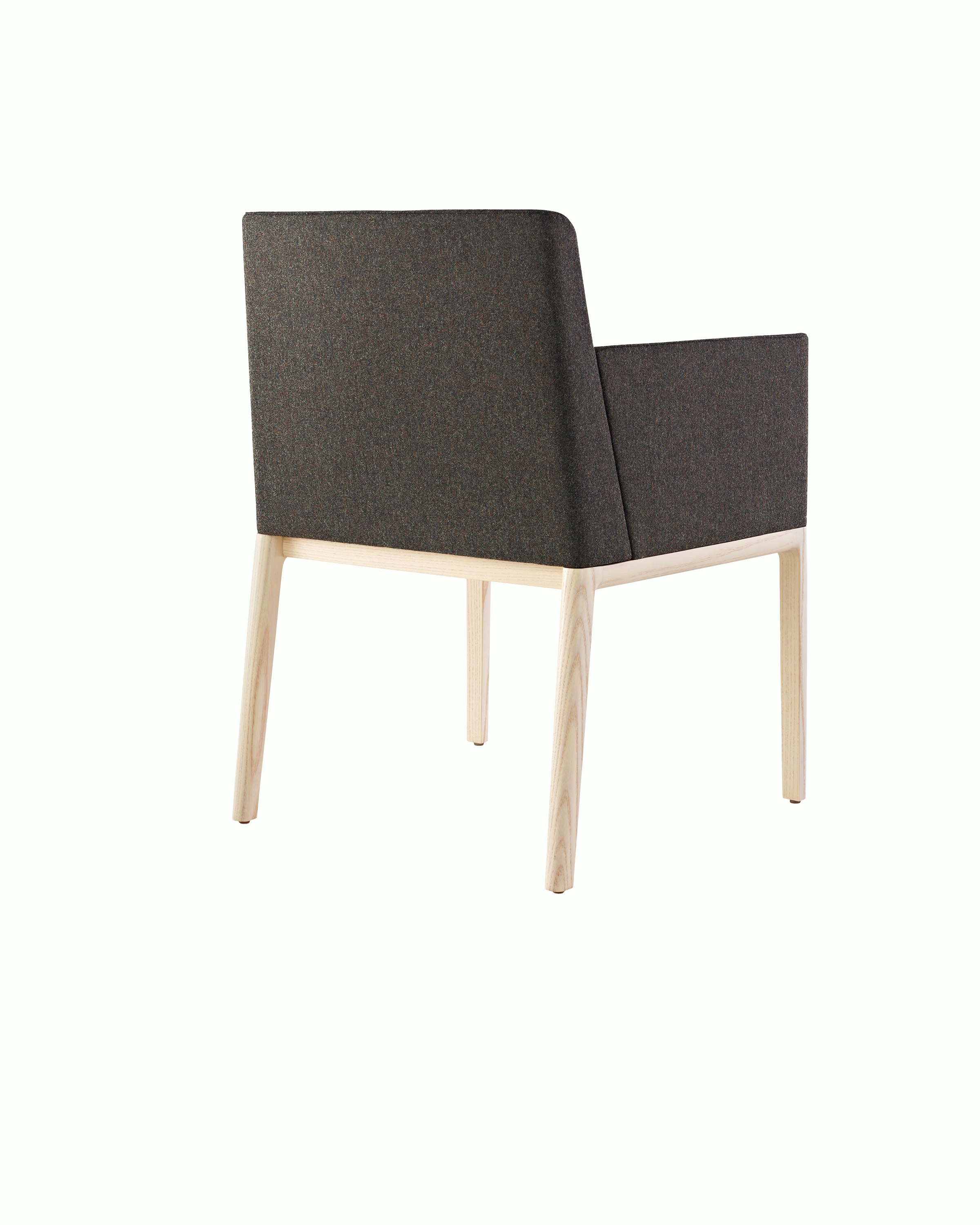 A Nessel side chair with black fabric upholstery, wraparound arms, and a wood frame with a light finish, viewed from behind at an angle.