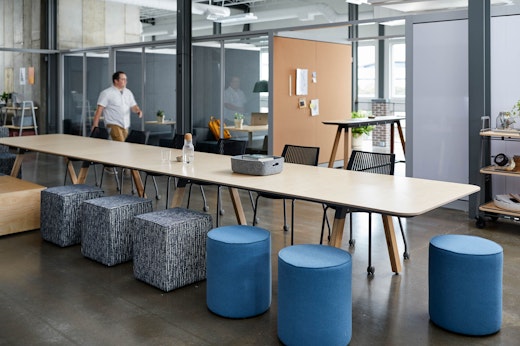 rockwell unscripted library table upholstered seats round swivel stools multigeneration by knoll muuto restore tray corky creative wall banquettes booths portal room pass through tall table drink rail cork markerboard mobile storage