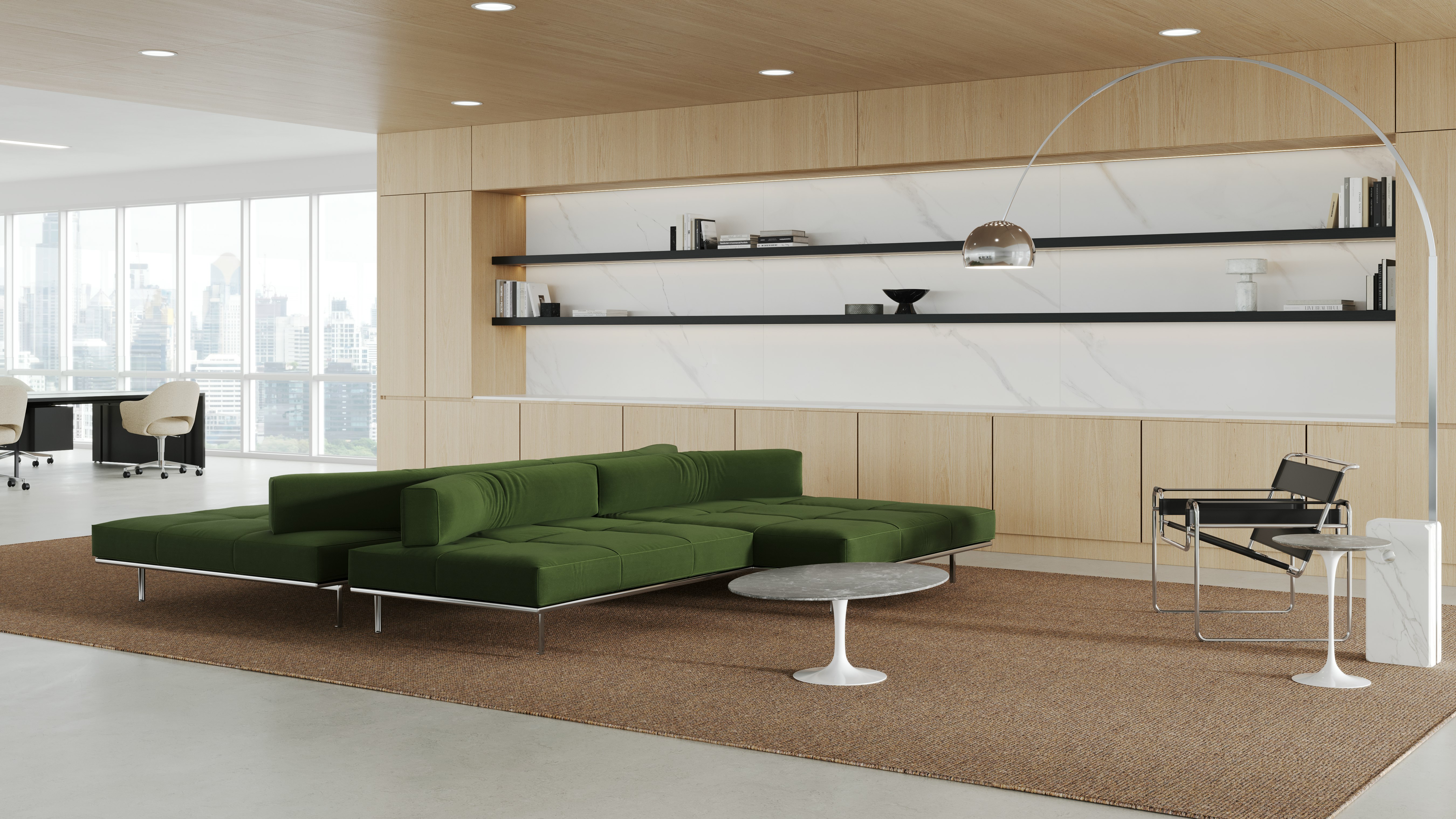 A private office with a lounge setting consisting of a Matic Sofa Collection, Wassily Chair and Saarinen low tables.