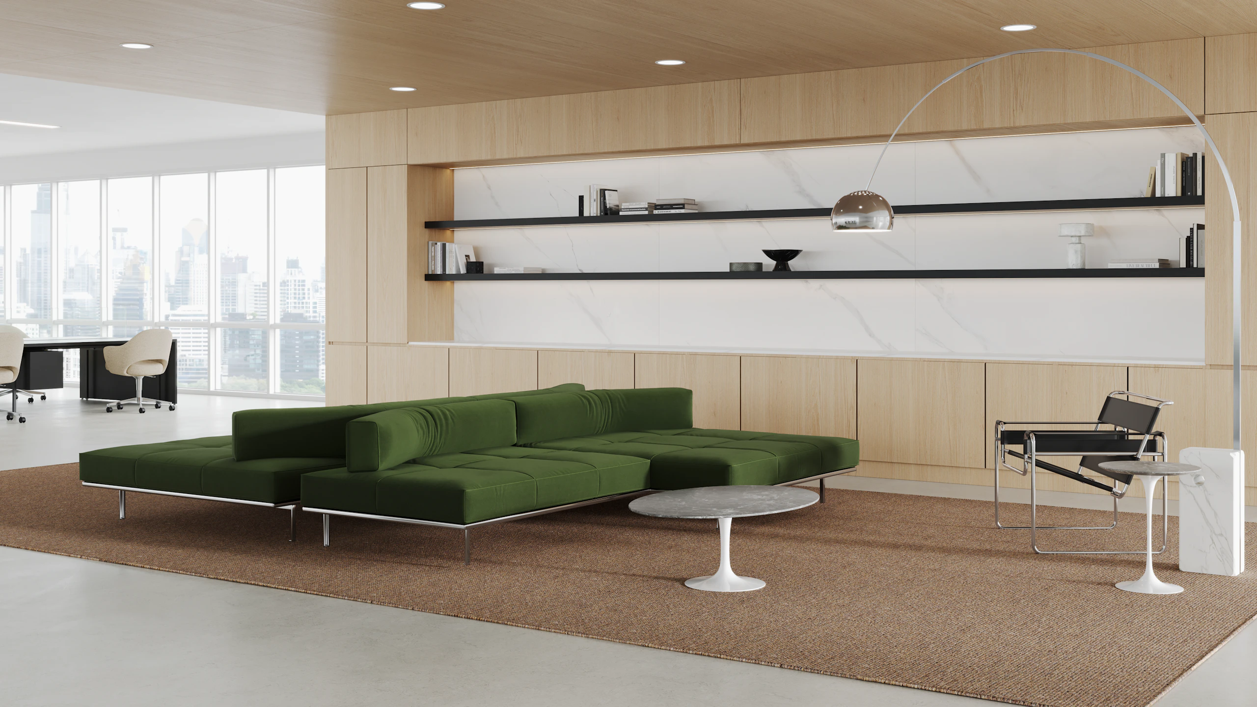 A private office with a lounge setting consisting of a Matic Sofa Collection, Wassily Chair and Saarinen low tables.