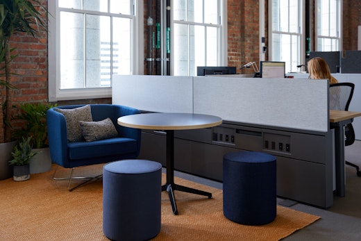 rockwell unscripted club chair and ottoman dividends Skyline x base table knoll san francisco showroom welcoming community essentials