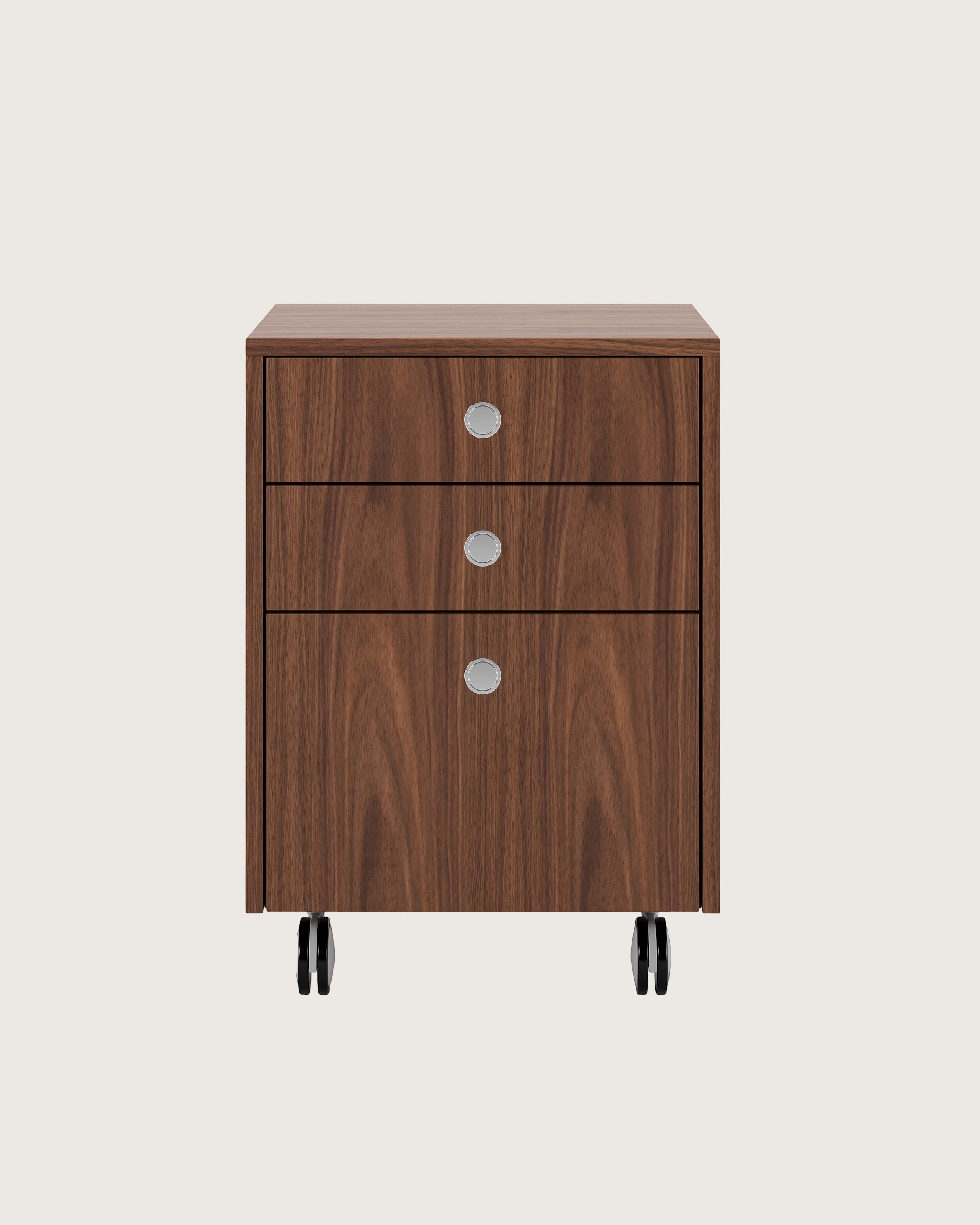 Sled Base Mobile Pedestal in walnut with three drawers and chrome pulls on casters viewed from the font.