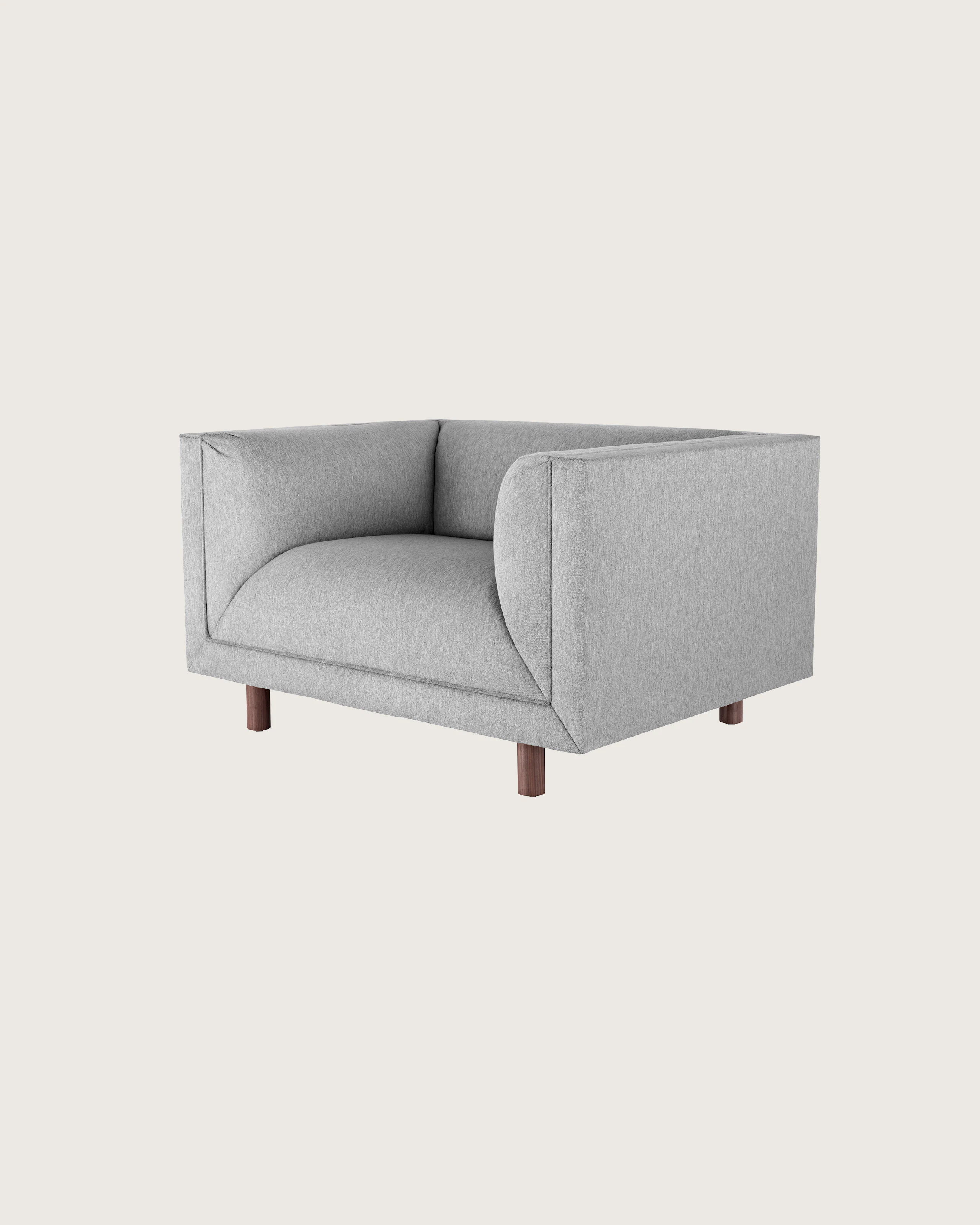 Angled view of a light gray club chair from the Rolled Arm Sofa Group, showing the low seat height.