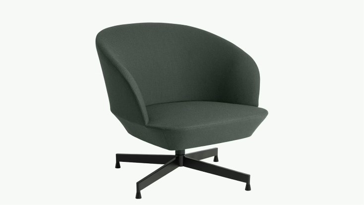 Green Oslo Lounge Chair by Muuto with a curved upholstered shell seat and black four-leg base.