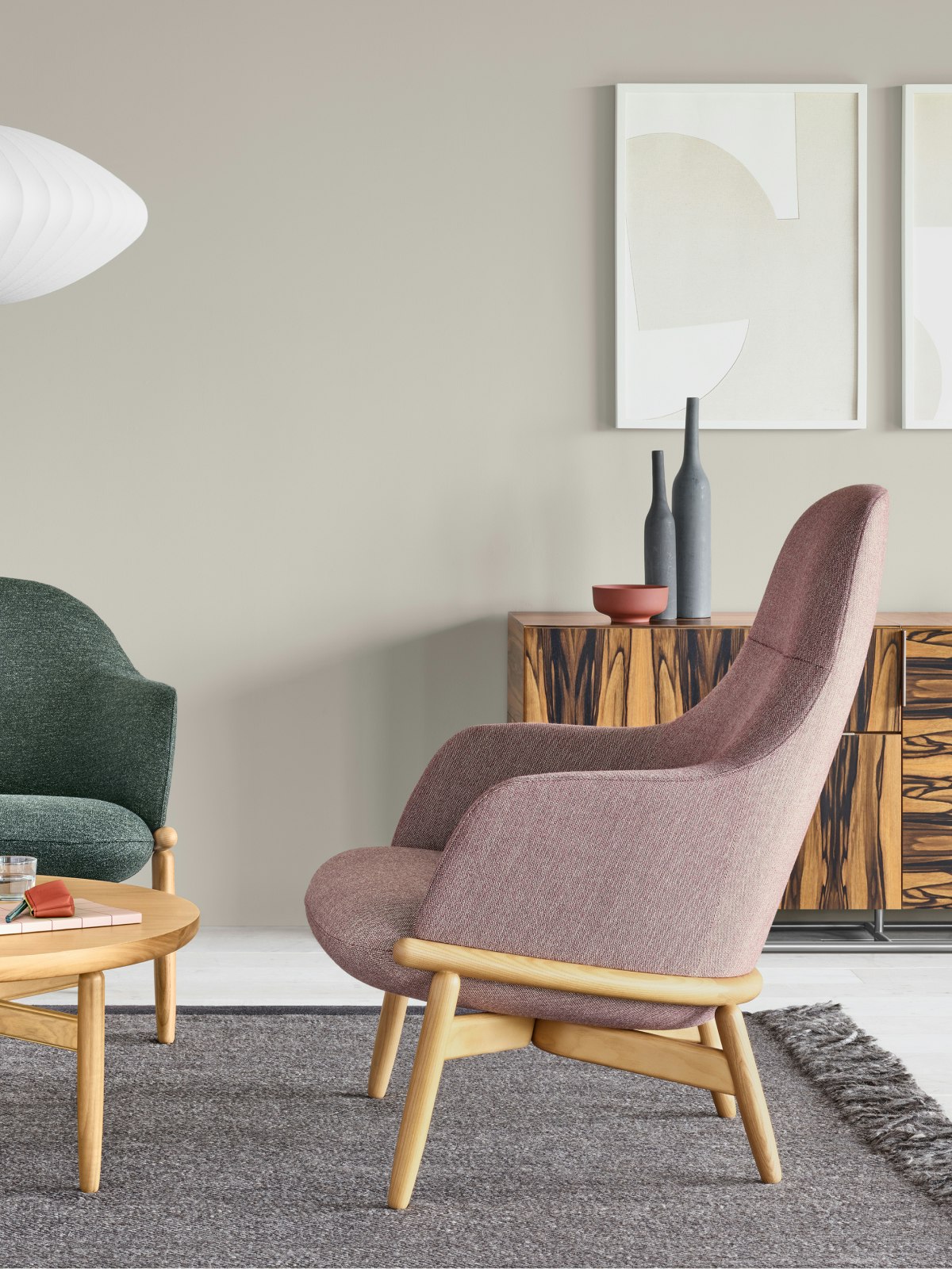 An office environment featuring a Reframe Lounge Chair and a Reframe Table.