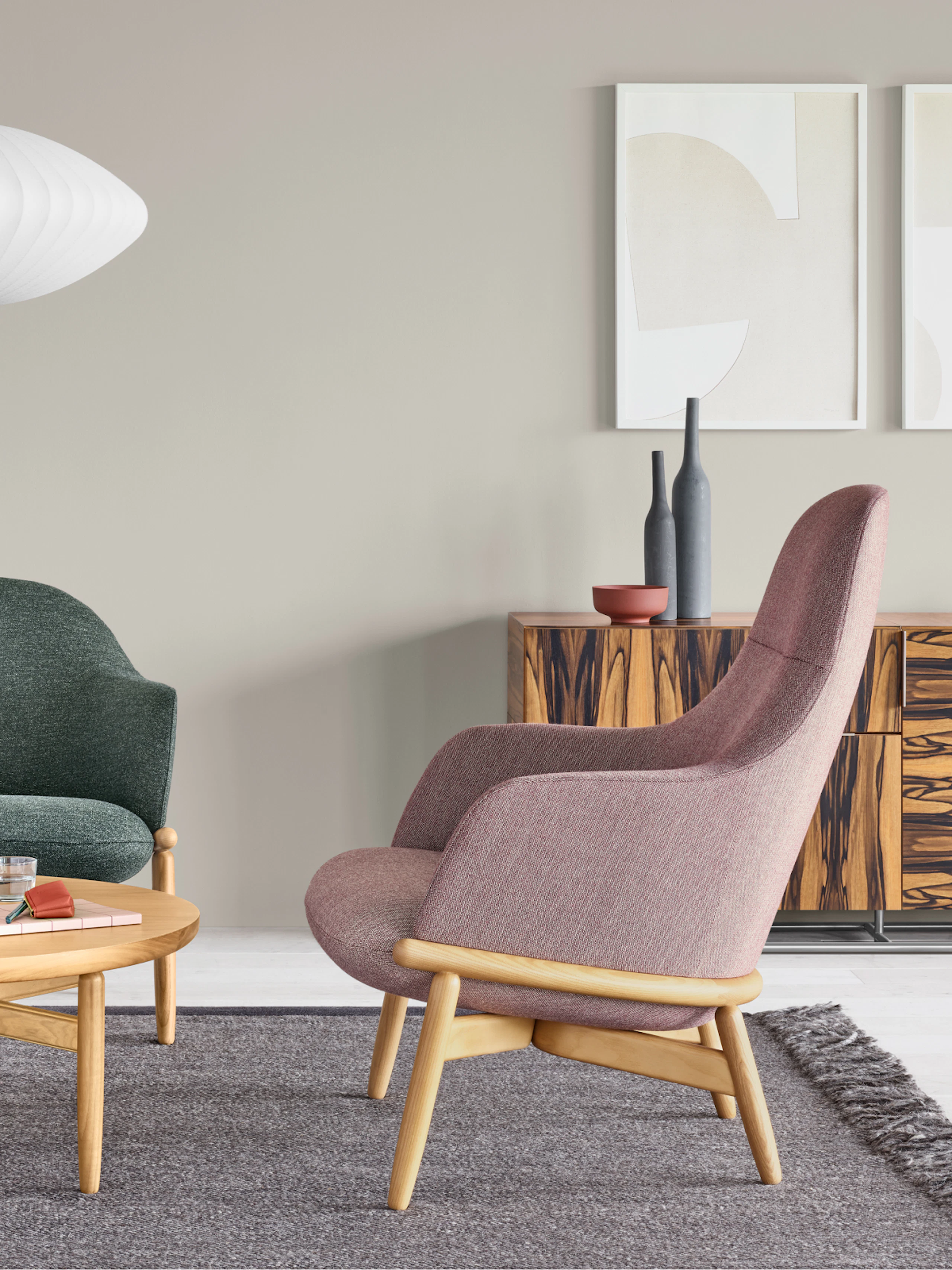 An office environment featuring a Reframe Lounge Chair and a Reframe Table.