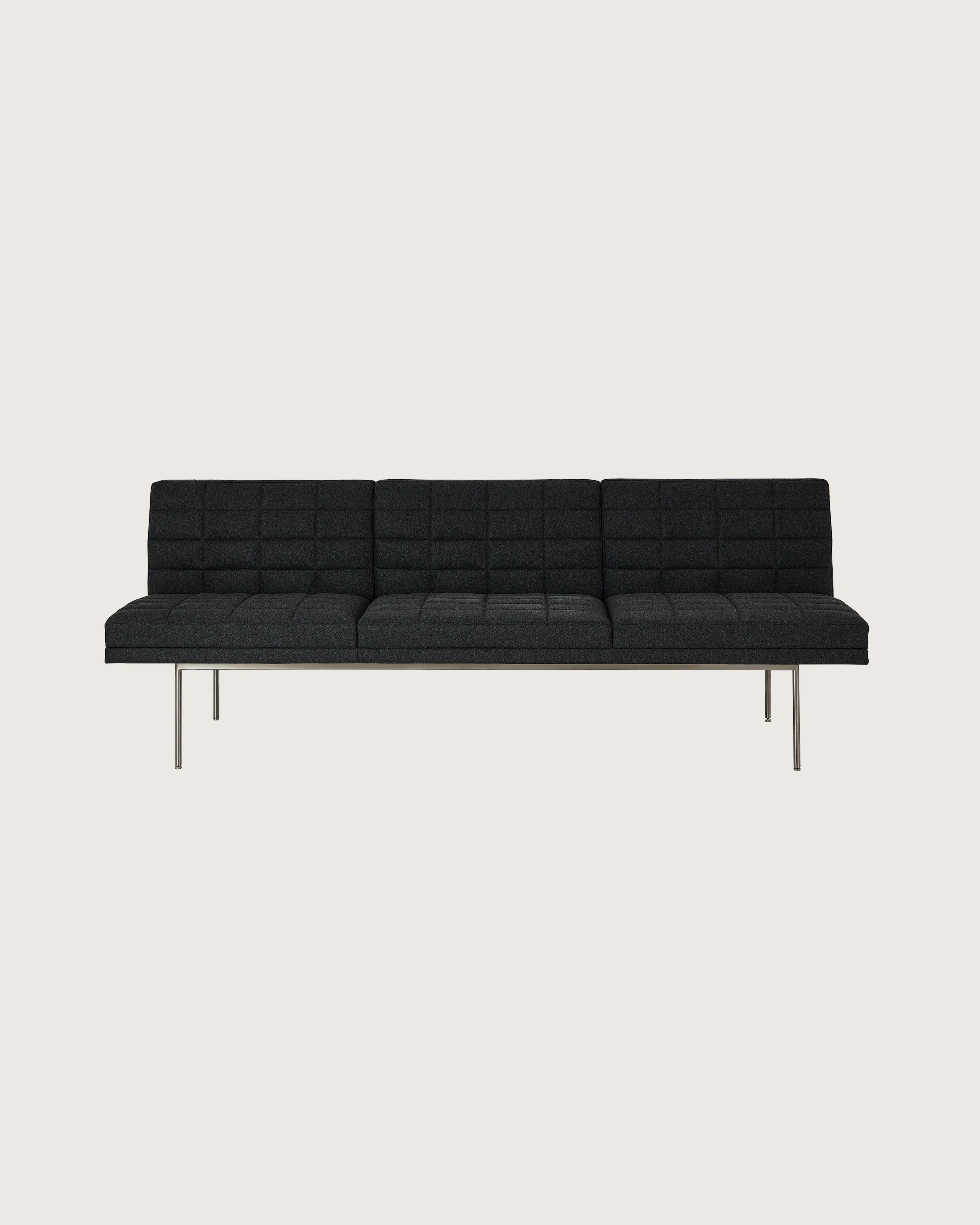 Tuxedo Component Sofa designed by BassamFellows upholstered in Bellano in Charcoal with a polished chrome base, shown front-facing on a white sweep.