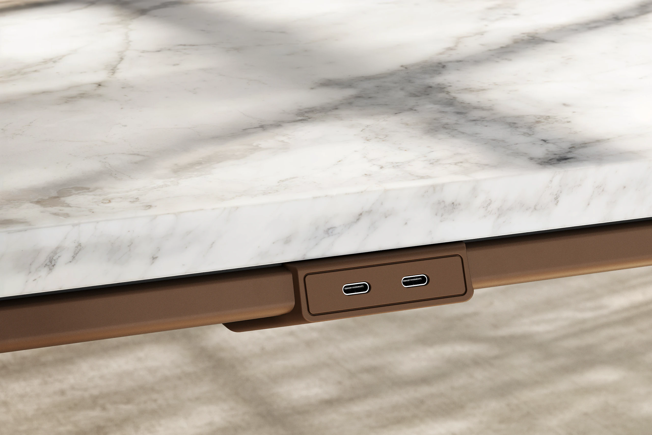 Detail of Ascent Conference Table by EOOS in White Carrara marble showing edge with power access in medium bronze viewed at an angle.