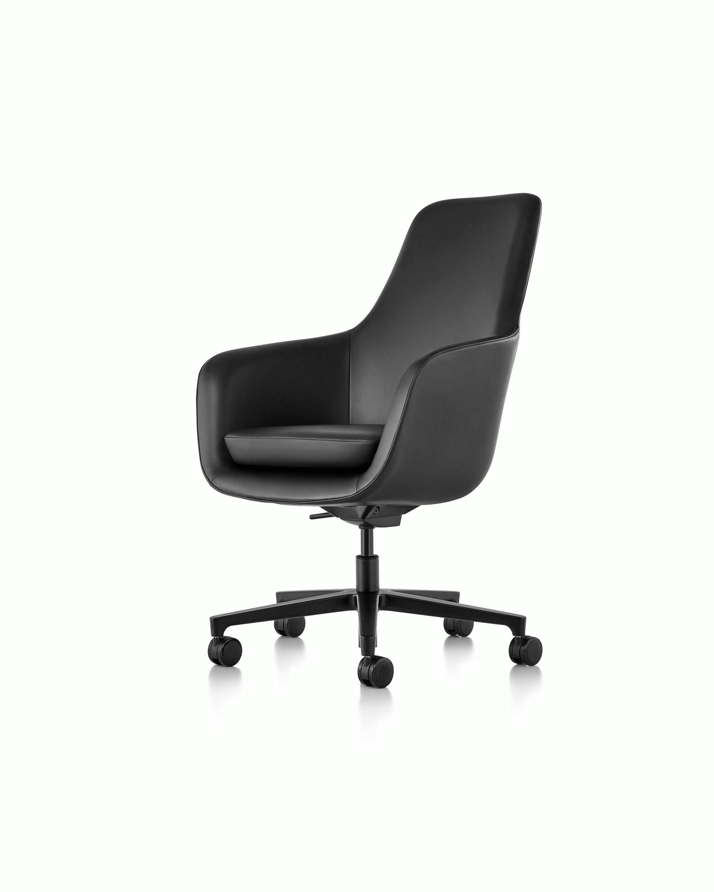 Partial angled view of the seat, back, and arms on a Saiba Chair with black leather upholstery.