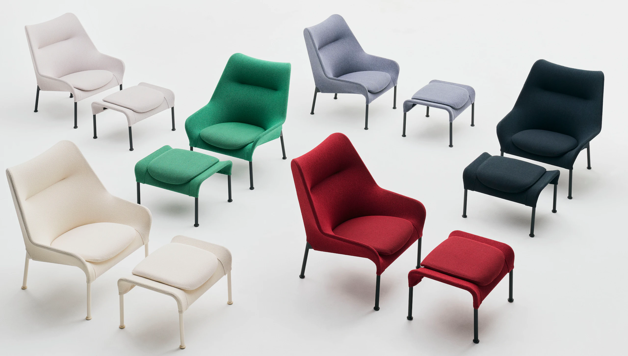 O2 Lounge Chairs and ottomans in red, cream, green, light gray, and dark gray staged on white background.