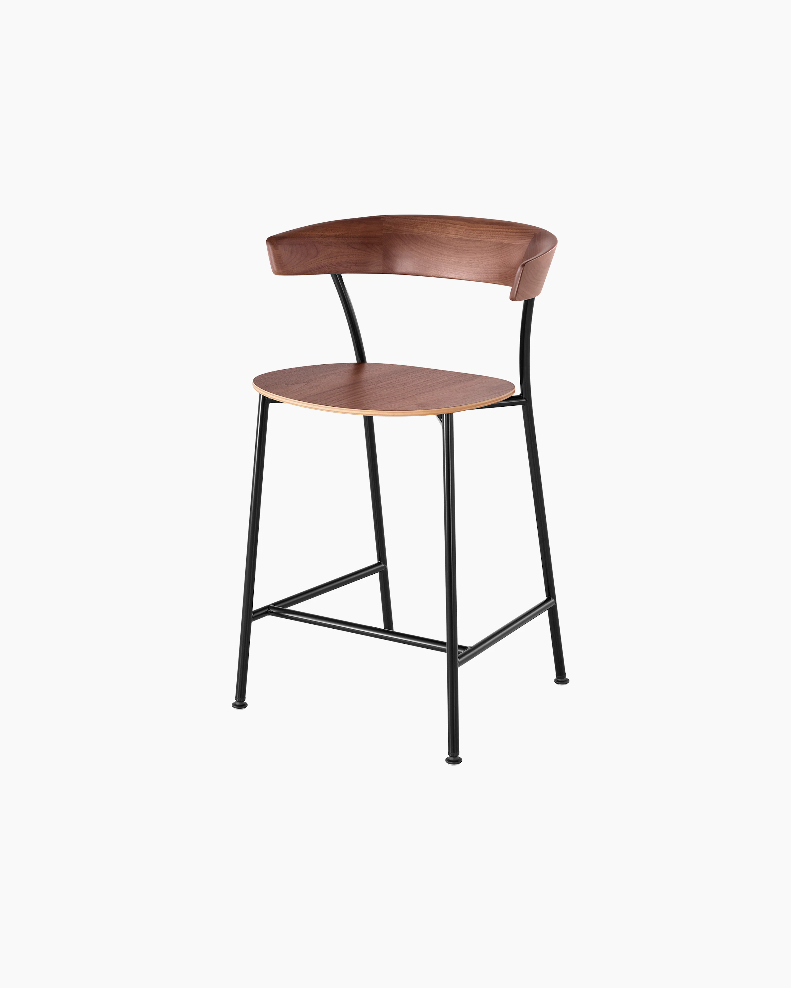 Angled view of a counter-height Leeway Stool with a metal frame and a wood backrest and seat in a medium finish.