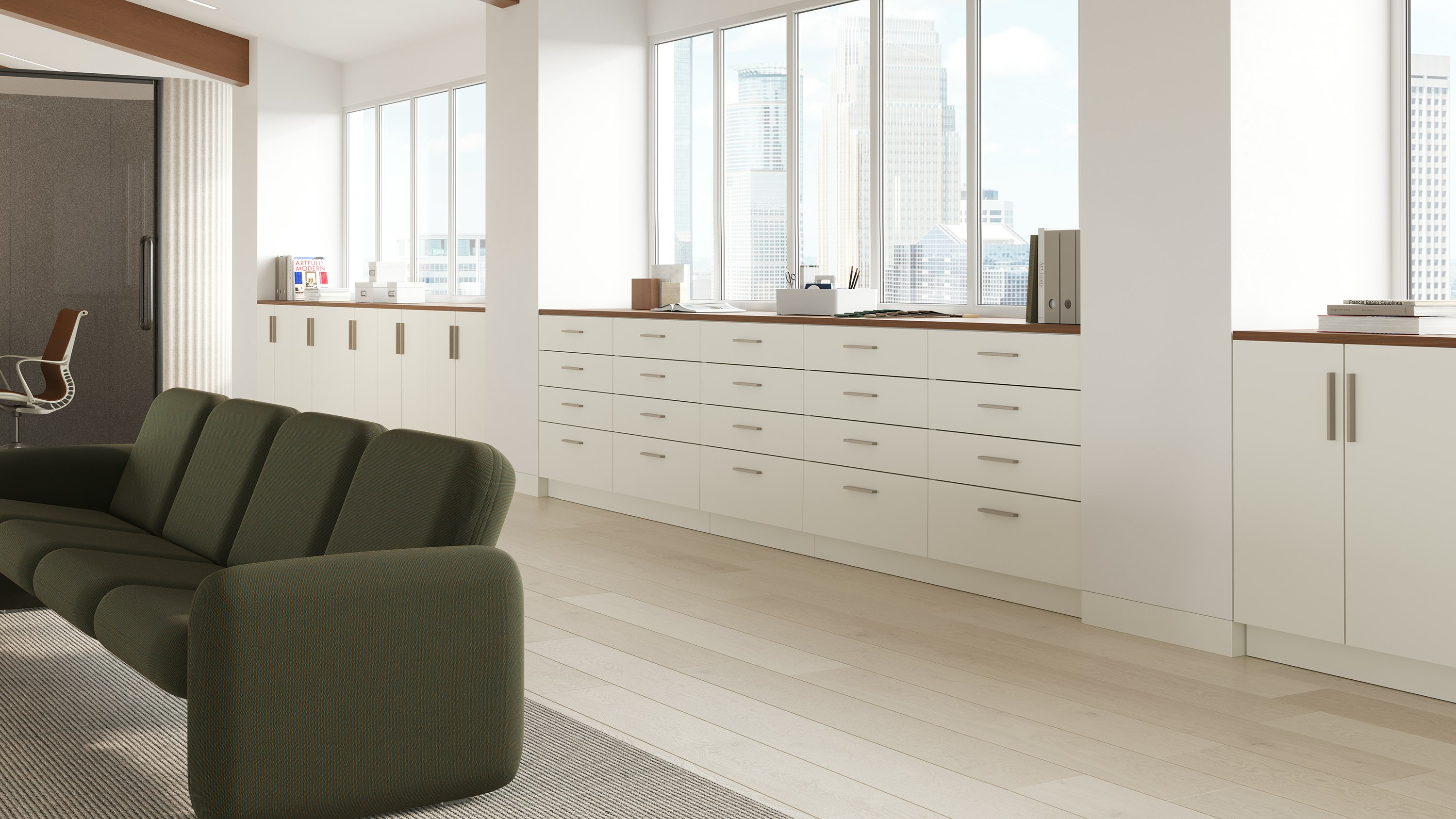 Mora System storage in a workplace setting in white finishes and walnut top.