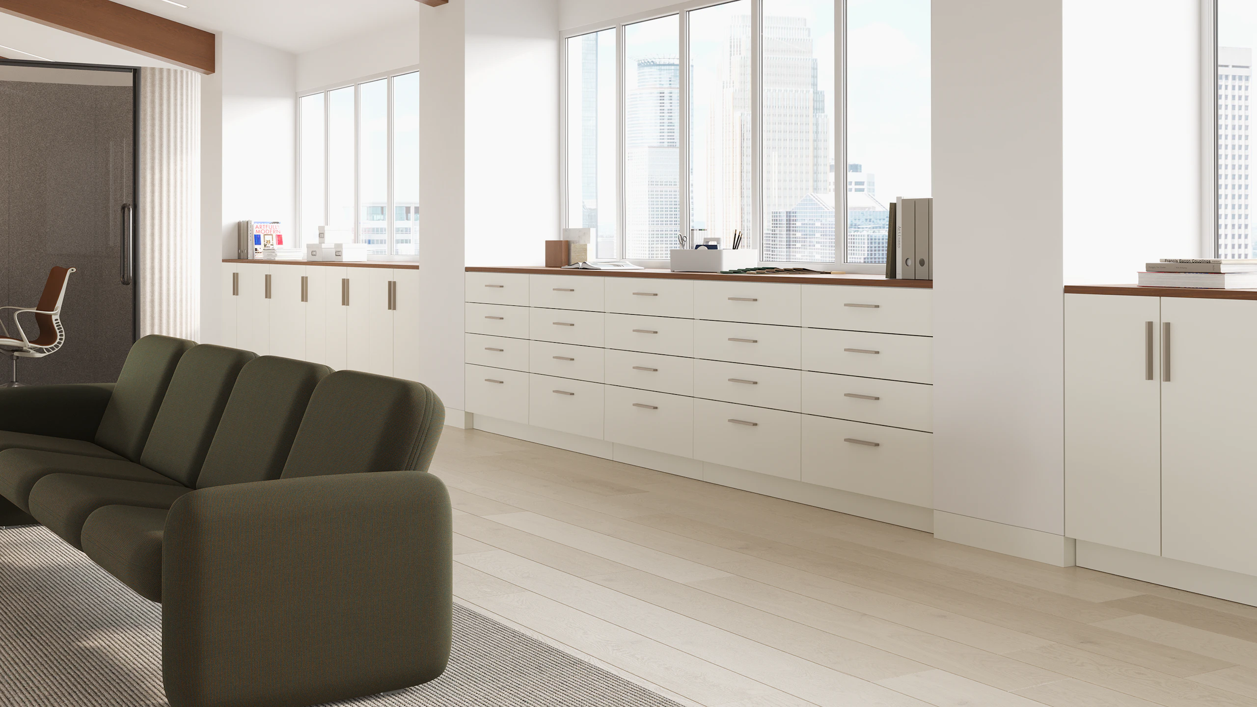 Mora System storage in a workplace setting in white finishes and walnut top.