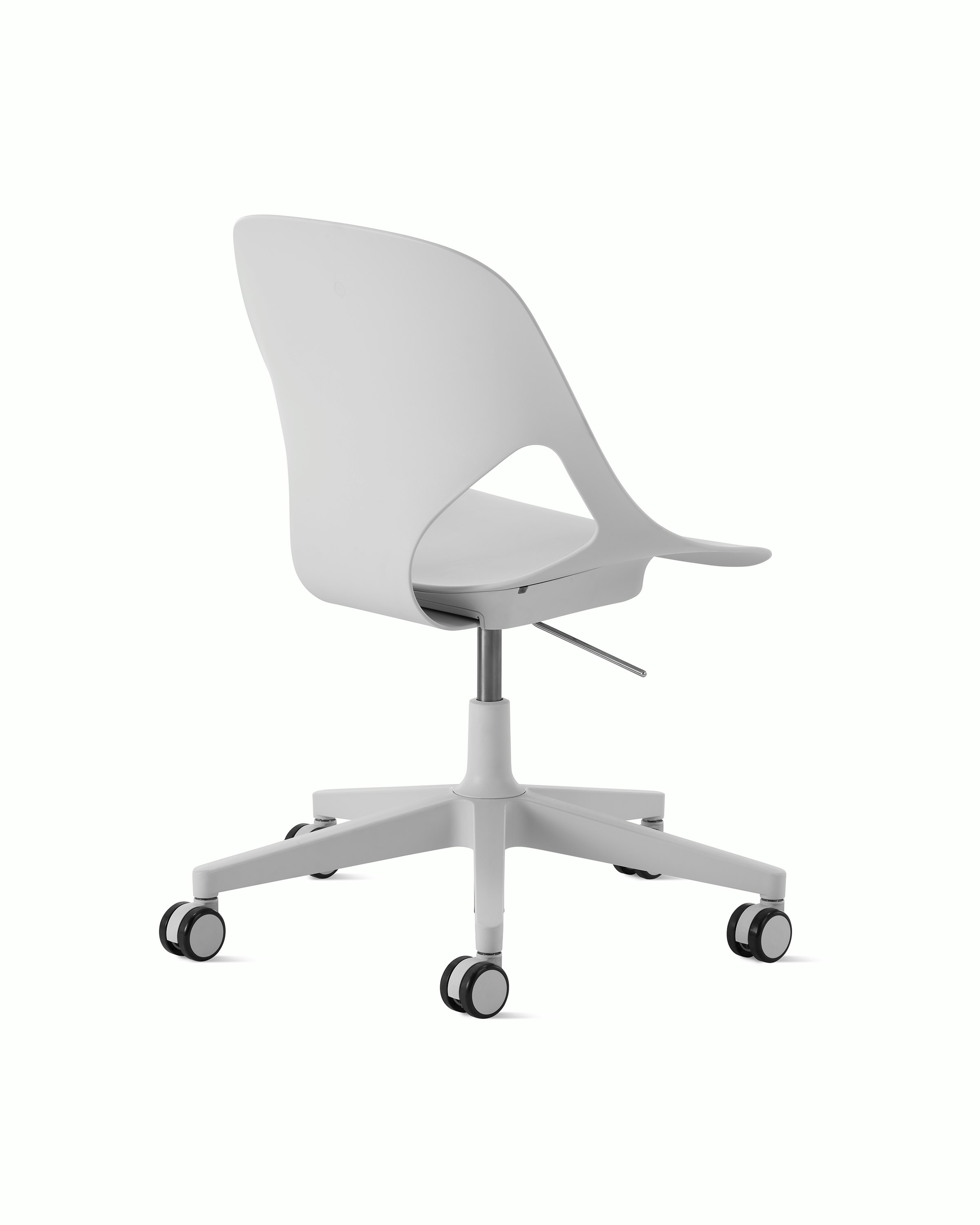 Rear angle view of a light grey armless Zeph chair.