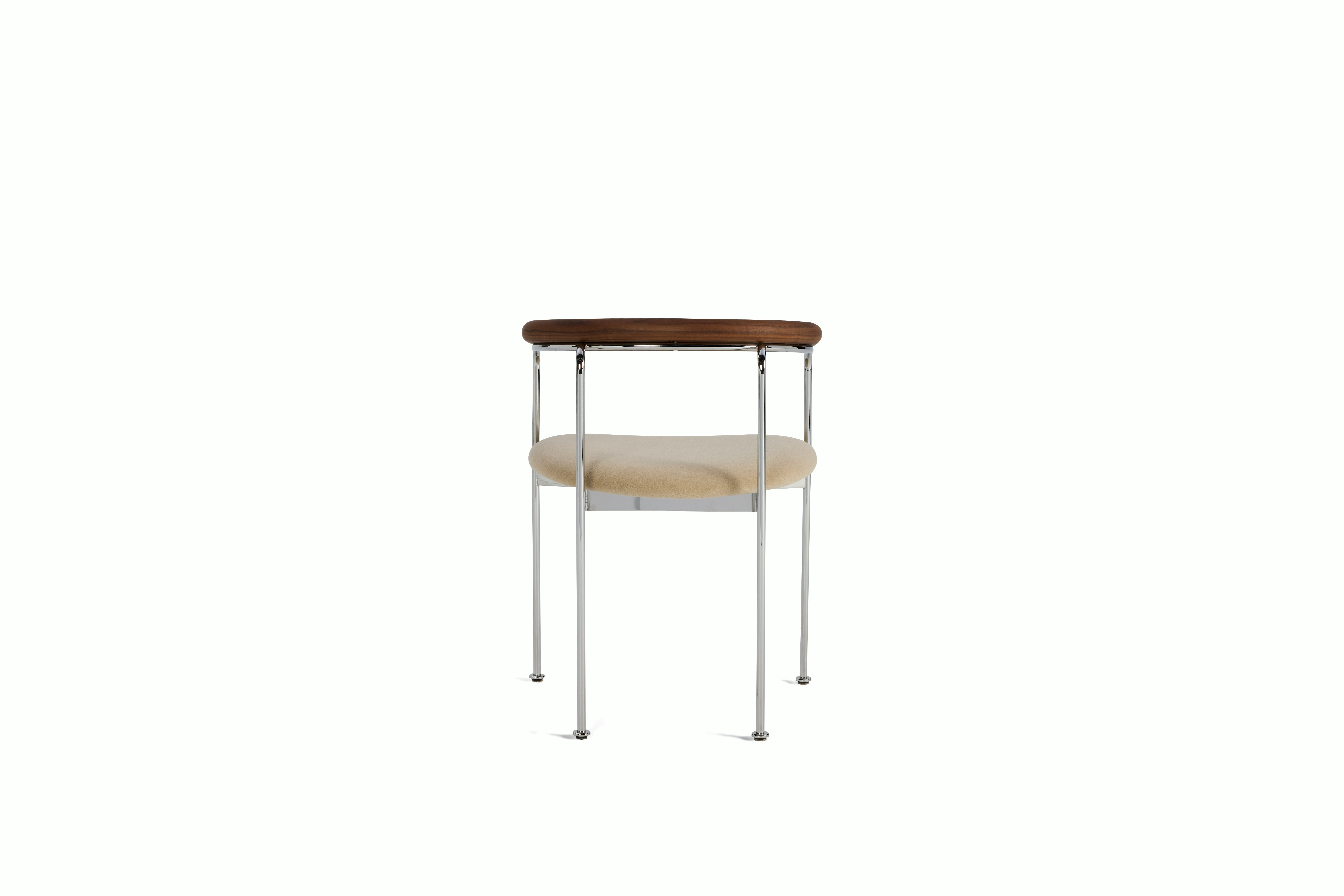 A Baia Dining Chair in Sand Walnut viewed from behind.