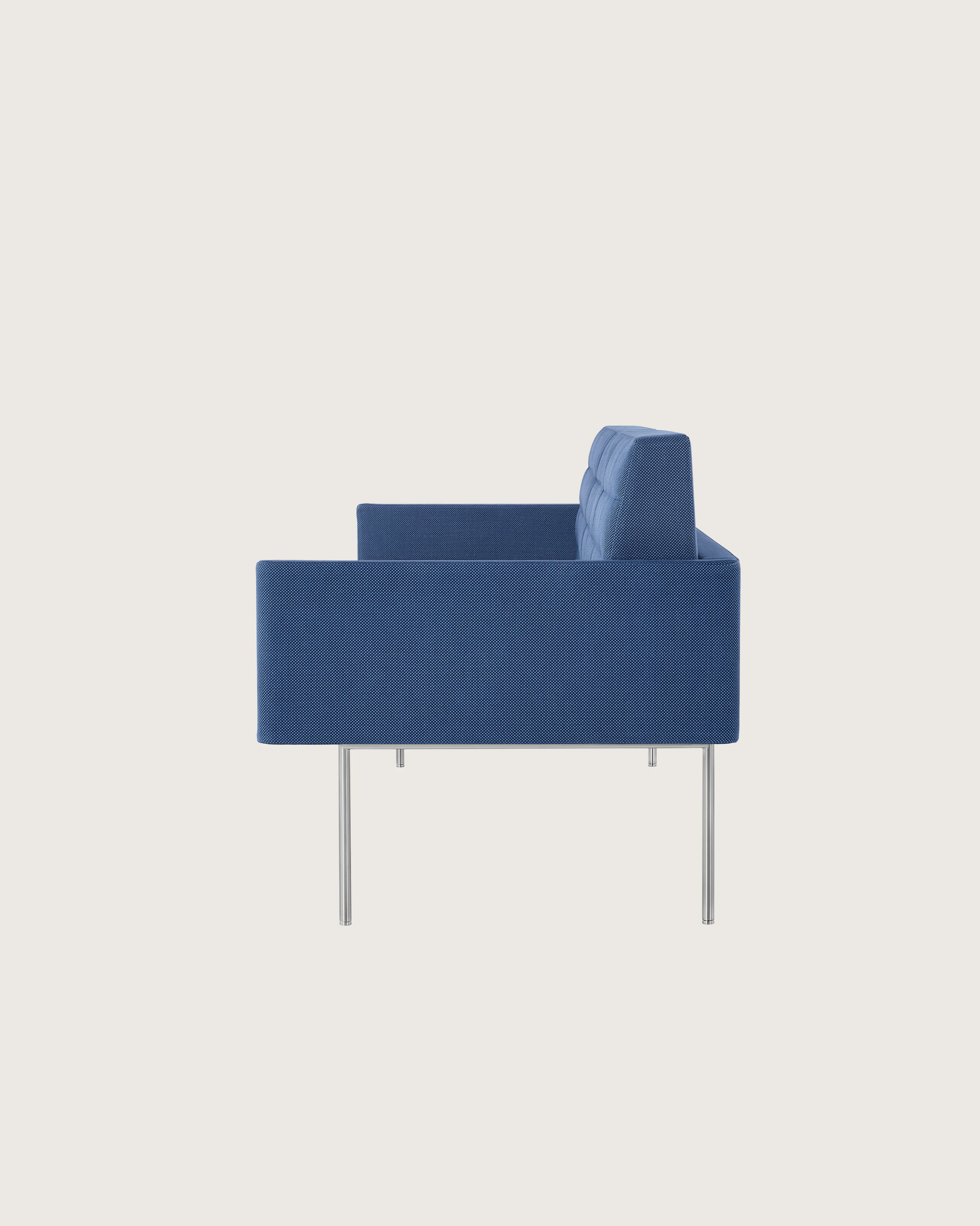 Profile view of a quilted Tuxedo Component sofa upholstered in blue fabric.