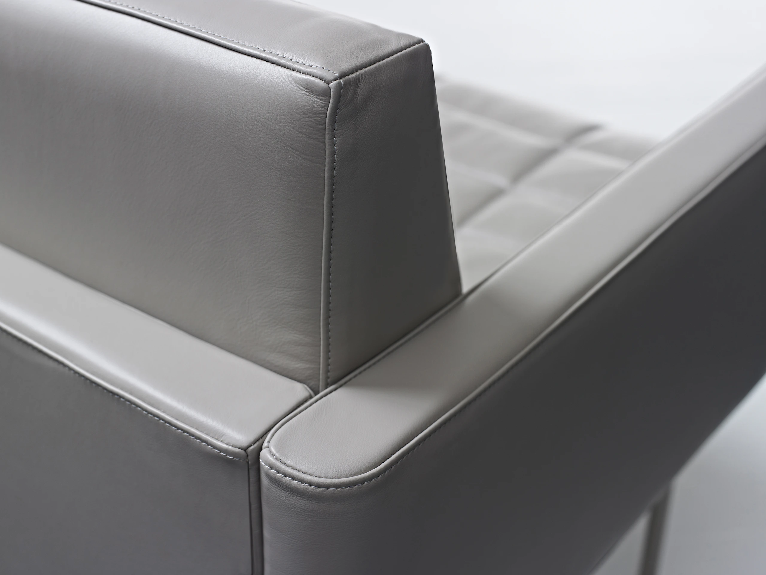 Close-up of a back corner on a Tuxedo Component club chair, showing the stitching detail.