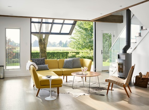 Rockwell Unscripted Modular Lounge with KnollStudio Risom Lounge Chair Saarinen Side Table Rockwell Unscripted Occasional table