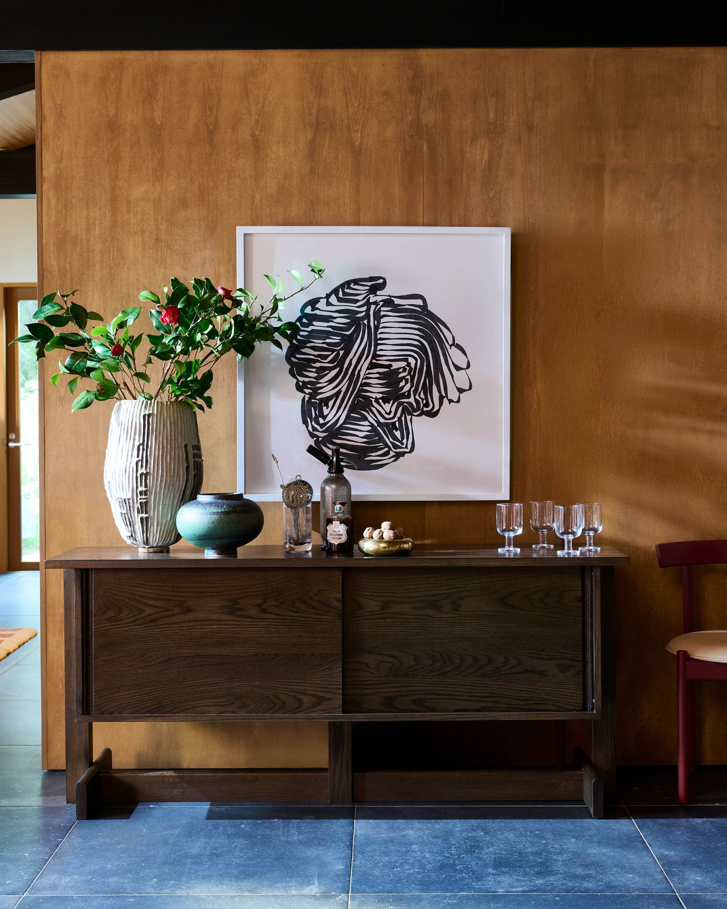 Land credenza in umber on oak in hallway with oak clad wall