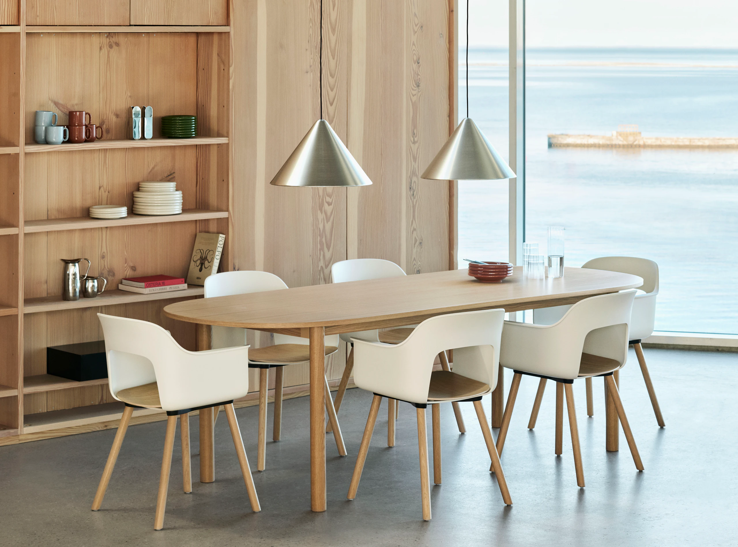 Layout Armchair 222 with plastic arm shell and plywood seat, shown around Annex Table in lounge setting.