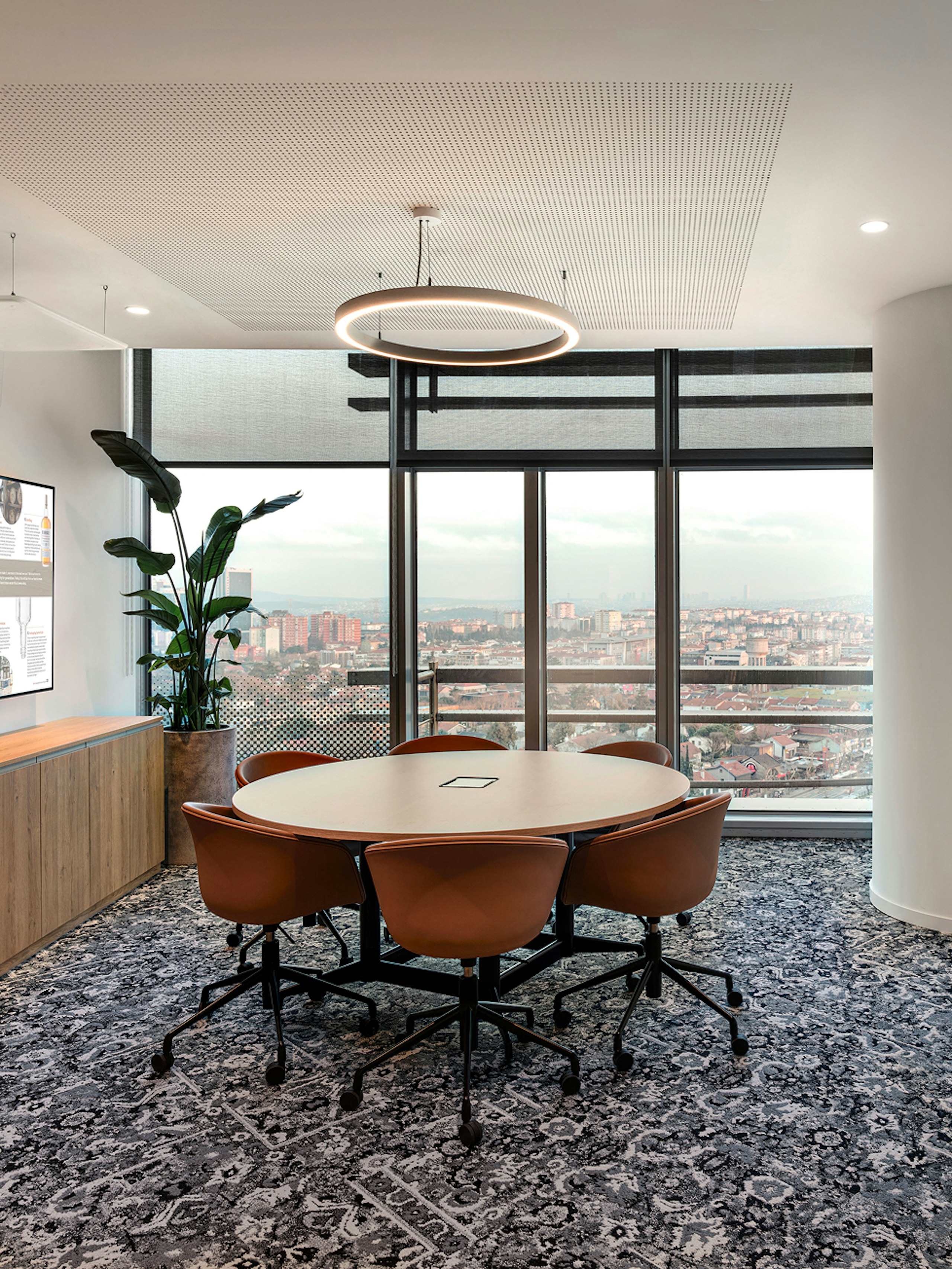 Meeting room with round Civic Table and About A Chair 53.