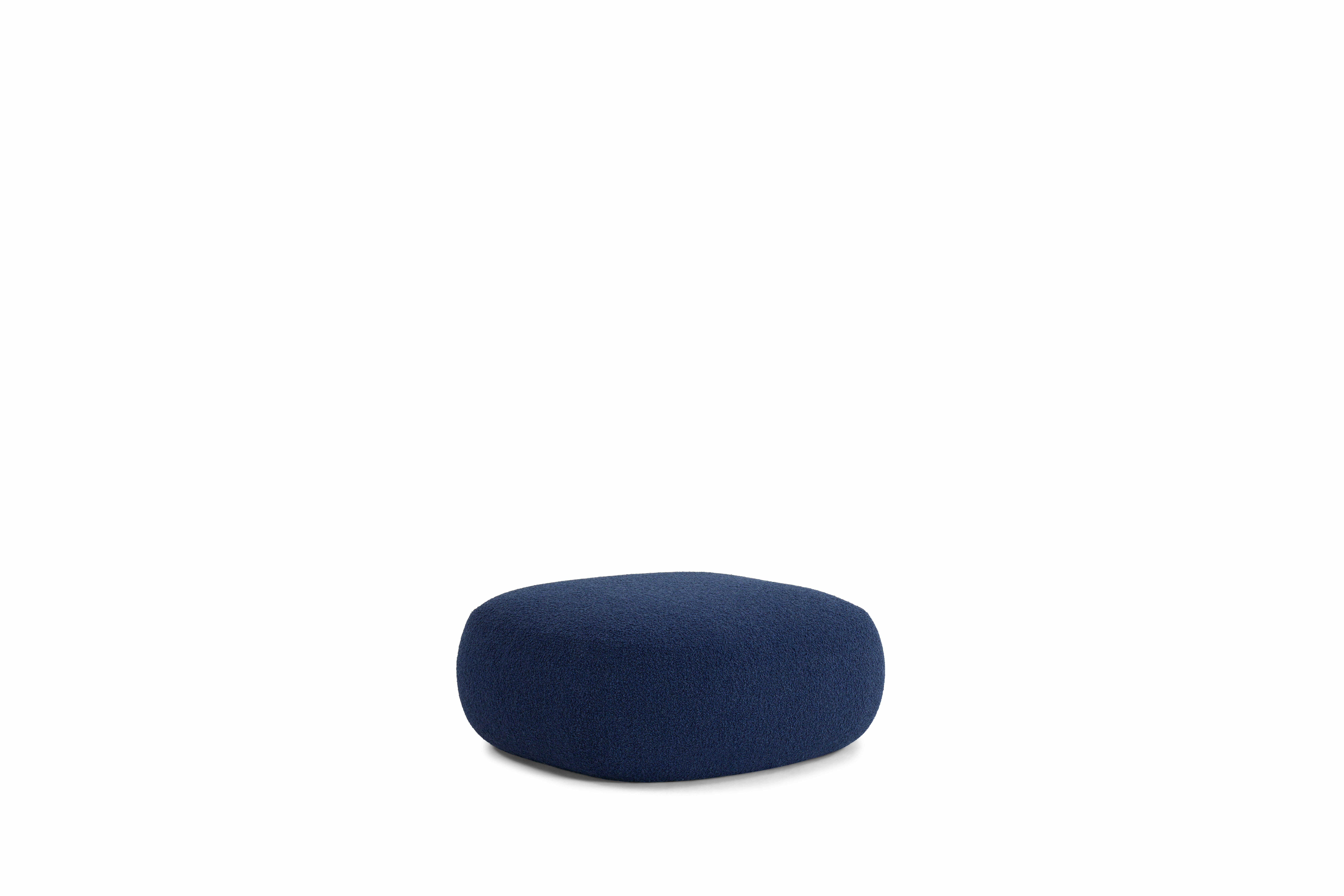 A Biboni Ottoman in Solid Sublime, Navy viewed from an angle.