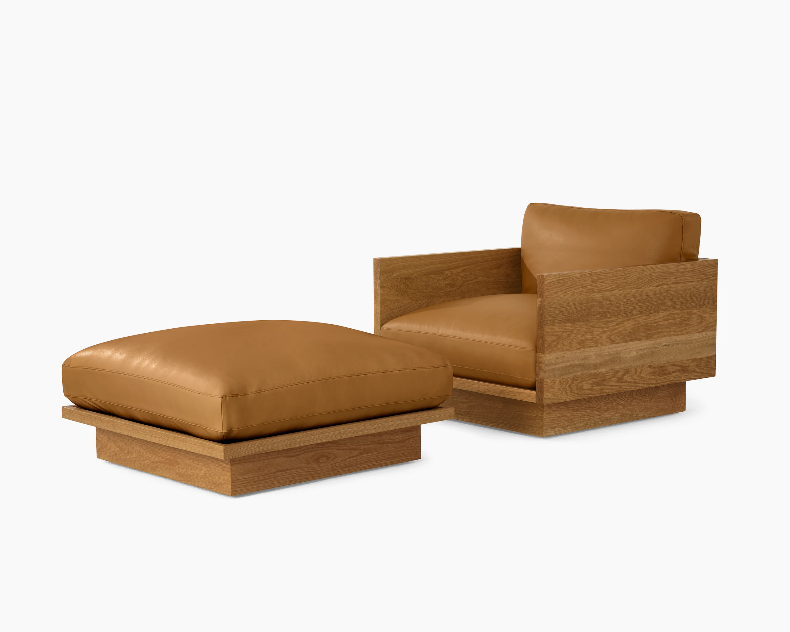 Pawson Drift Lounge Chair and Ottoman with white oak frame and light brown leather upholstery.