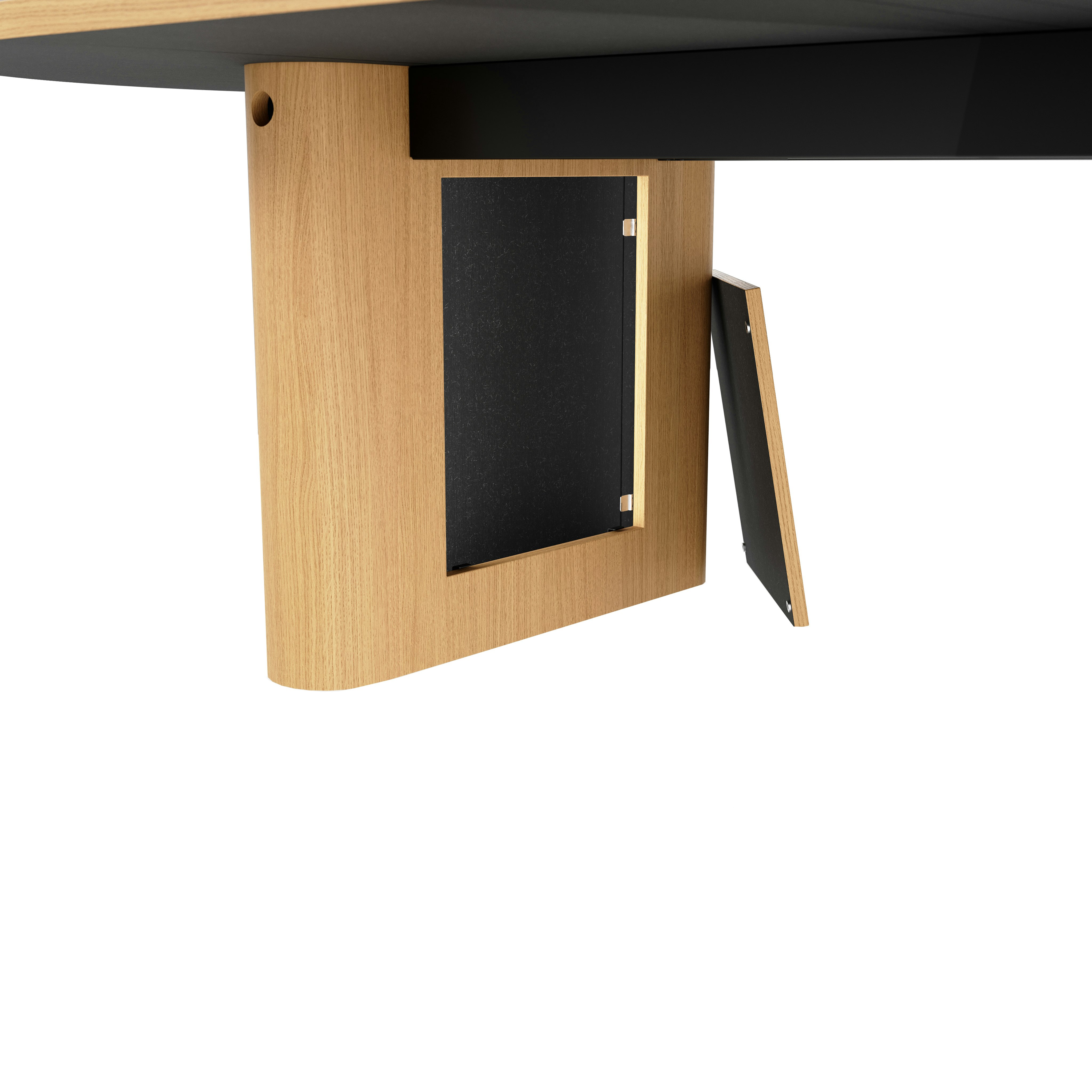 Detail shot of open wire management leg on JD Conference Table in Natural Rift Cut Oak with a racetrack-shaped base.