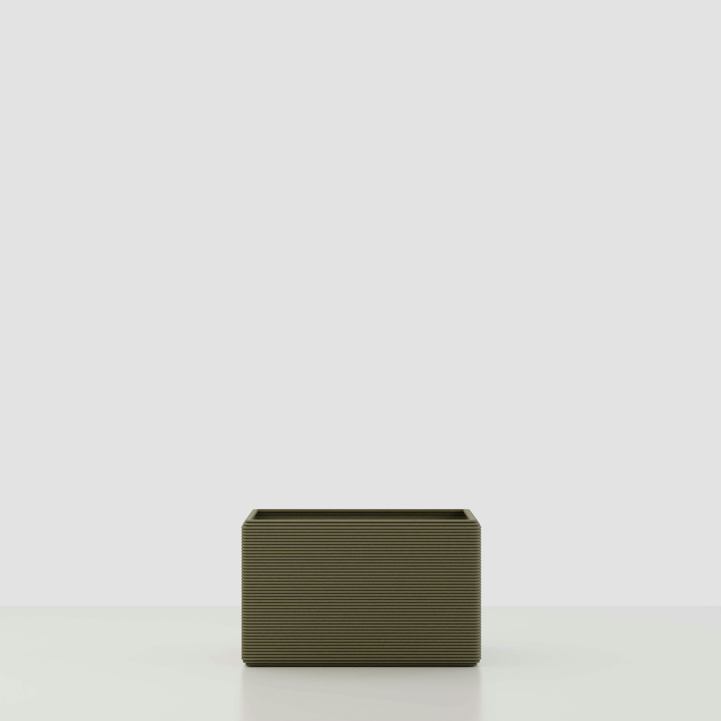 A Avila 3D Printed Concrete Planter in Mossy Glen Viewed from the front.