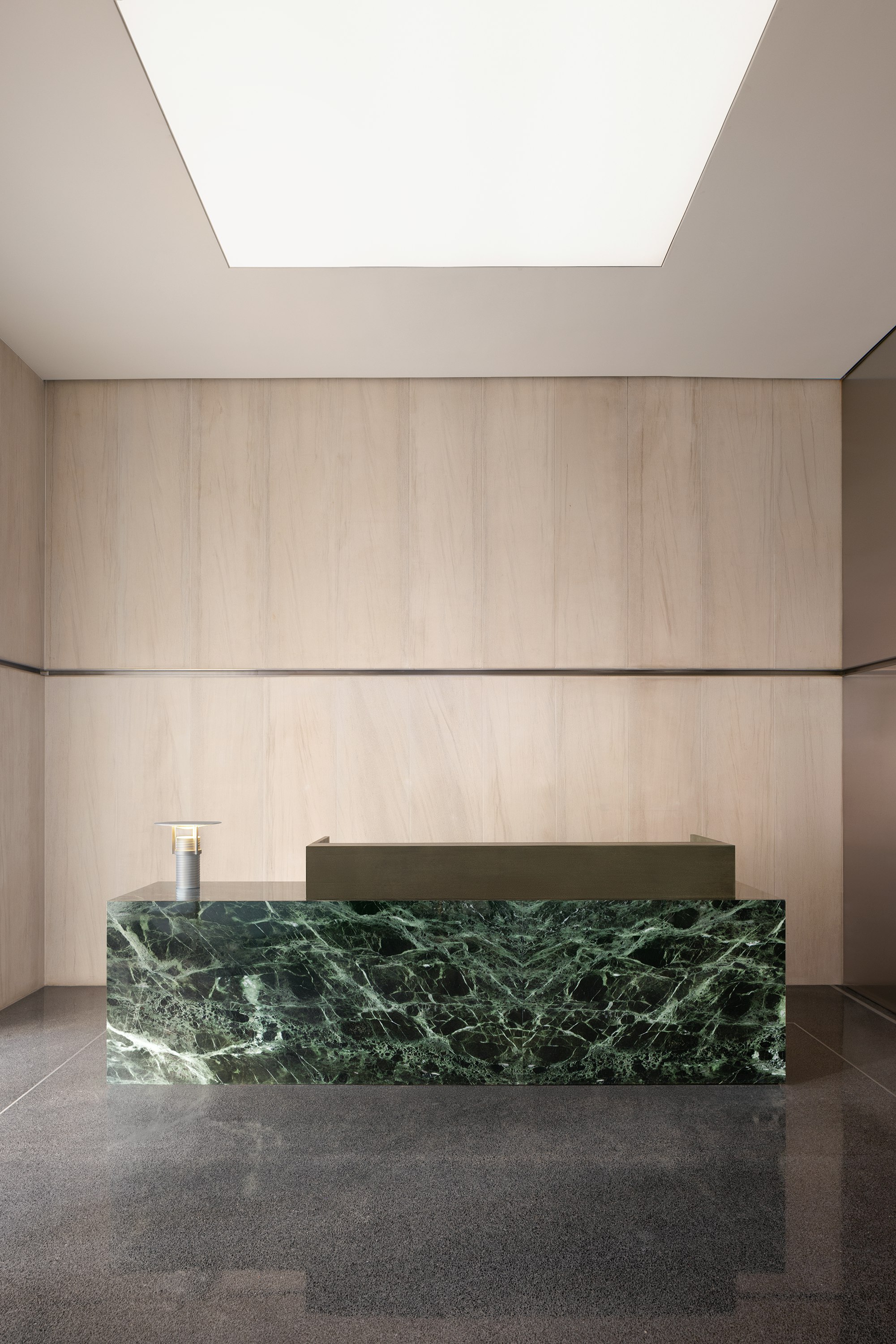 Custom green marble reception area by Geiger.