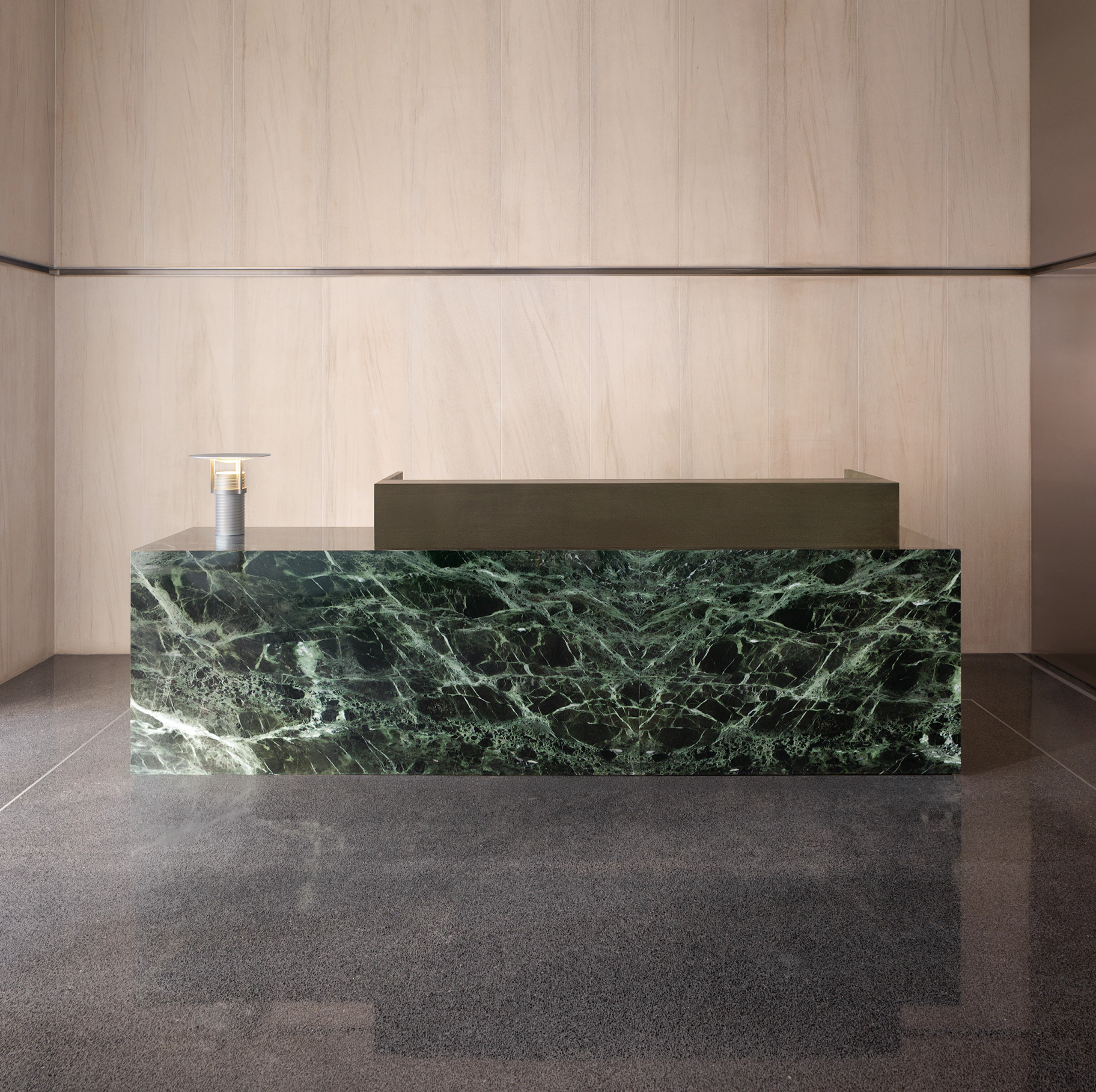 Custom green marble reception area by Geiger.