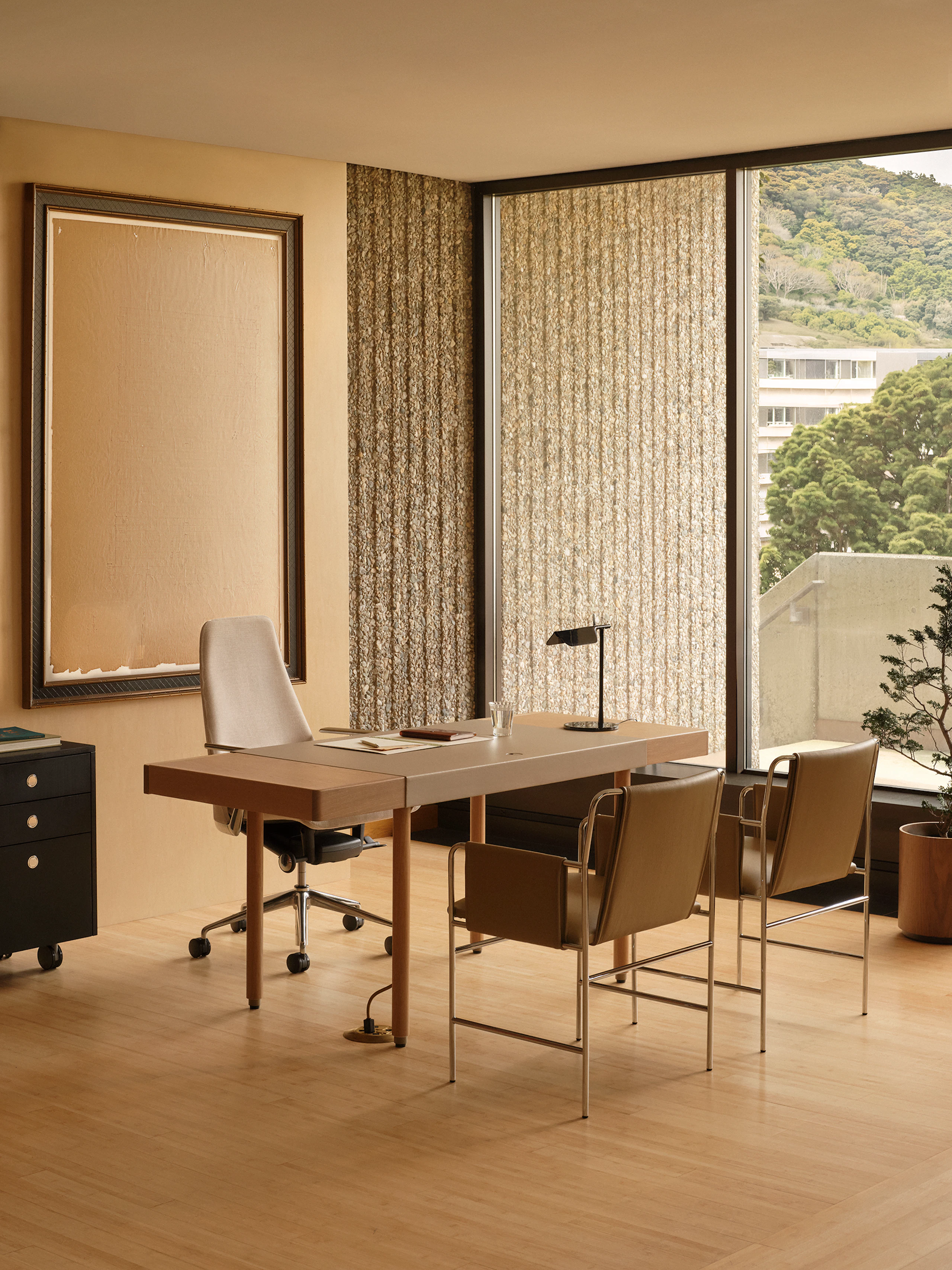 Office set up with leather wrap desk and envelope chairs