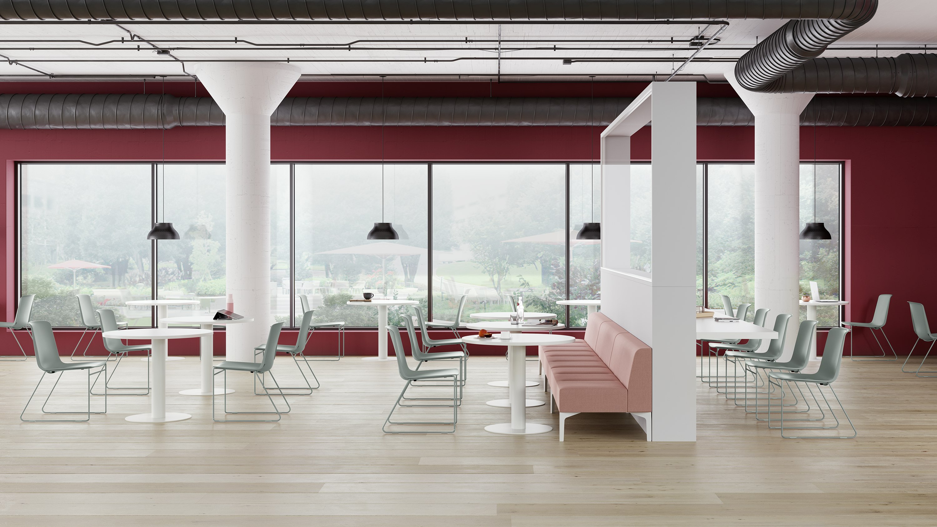 A Café with glacier blue Pronta Stacking Chairs, white Genus Tables, and pink naughtone Hatch Modular Seating.