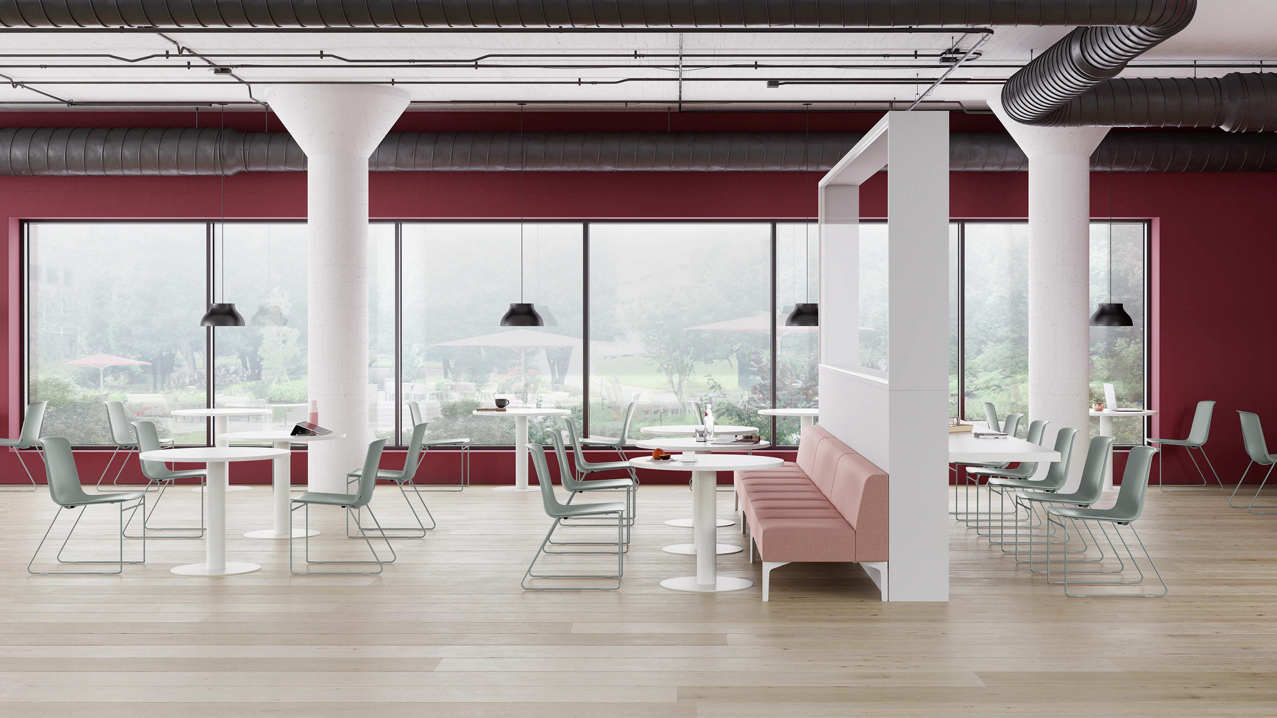 A Café with glacier blue Pronta Stacking Chairs, white Genus Tables, and pink naughtone Hatch Modular Seating.