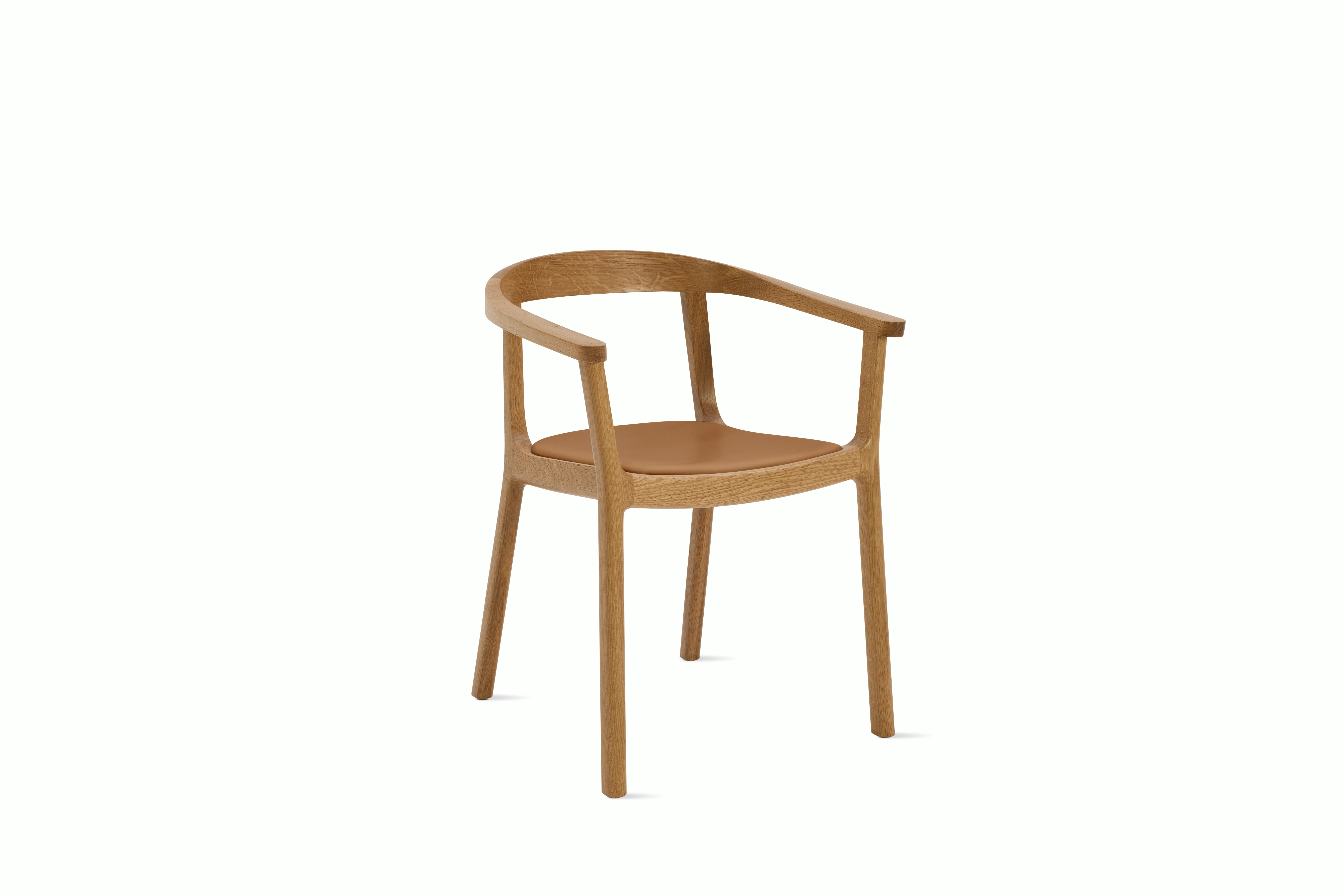 A Lijn Armchair in Bricolage Oak viewed from an angle.
