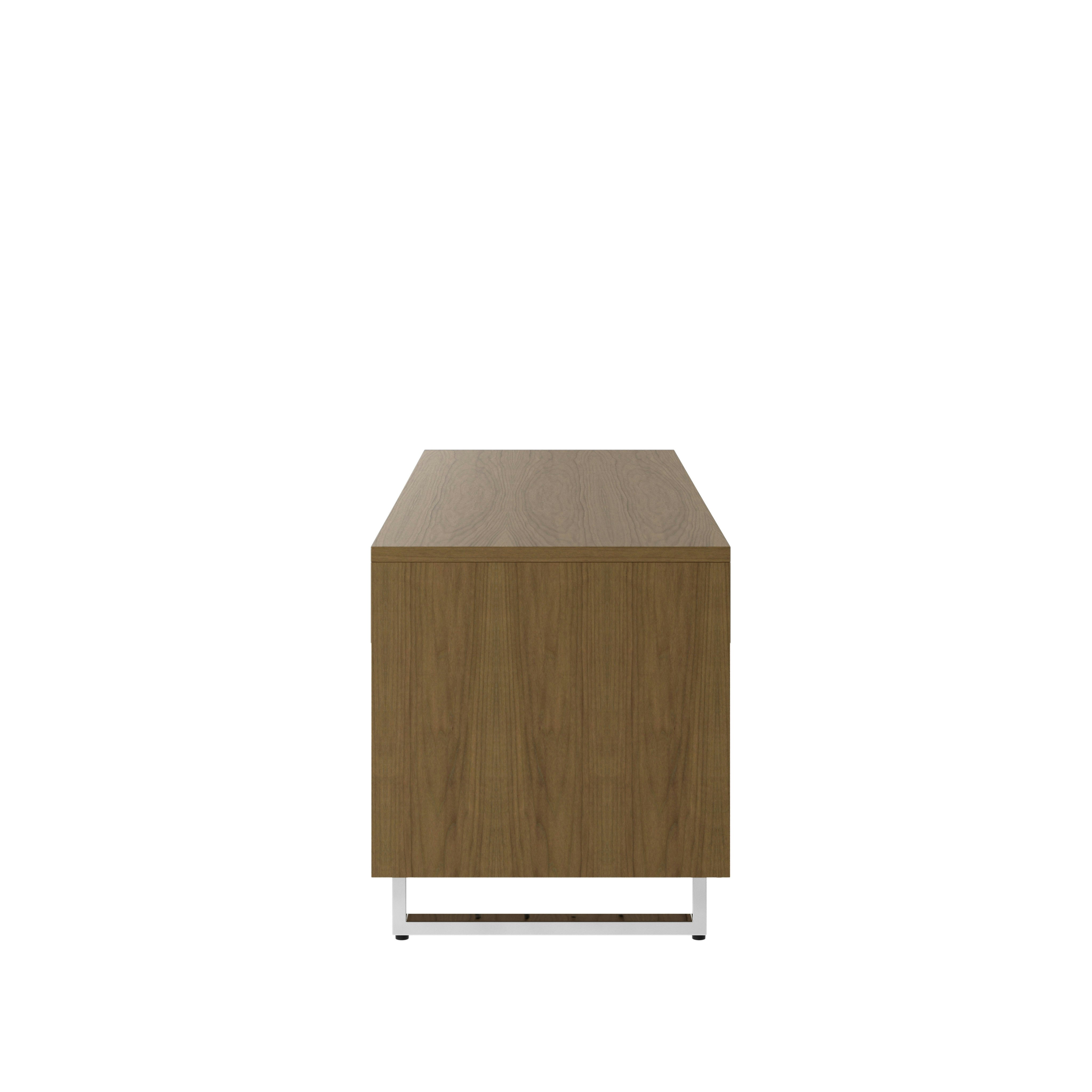 Highline Twenty Five Credenza in Natural Flat Cut Walnut with Polished Chrome base and drawer pulls viewed from the side.