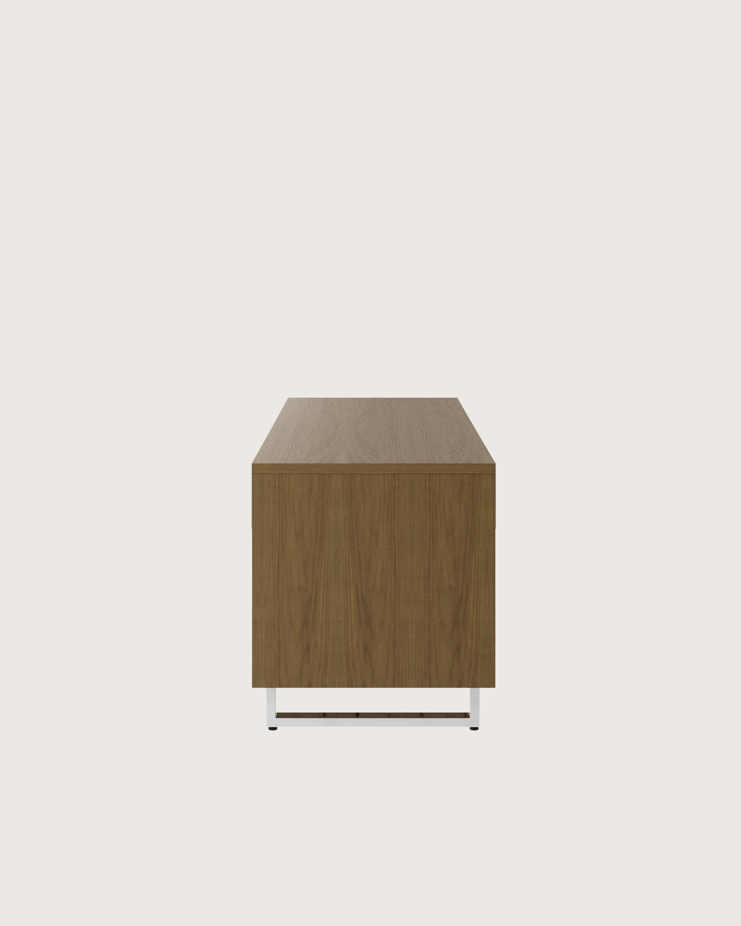 Highline Twenty Five Credenza in Natural Flat Cut Walnut with Polished Chrome base and drawer pulls viewed from the side.