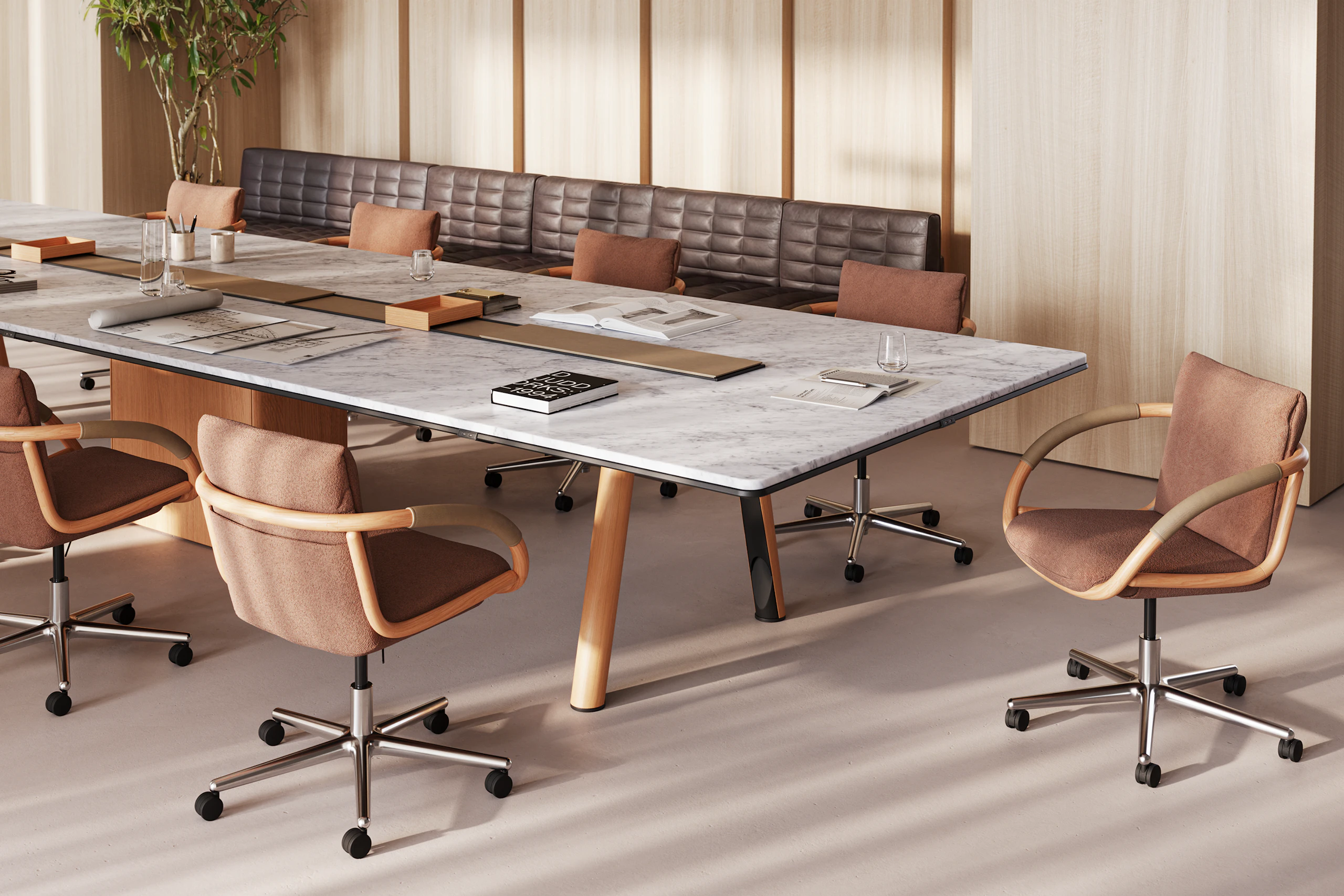 Ascent Conference Table with Full Loop Chairs, designed by EOOS, shown in White Carrara Marble with a Natural Rift Cut Oak base, viewed at an angle in a boardroom setting.