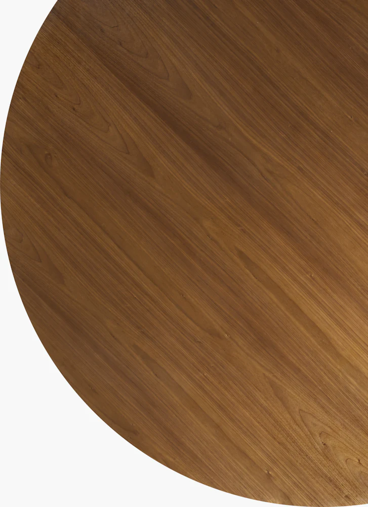 Round wooden pedestal table with wide circular base and stacked conical central support