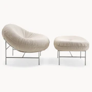 Beige lounge chair and ottoman set.